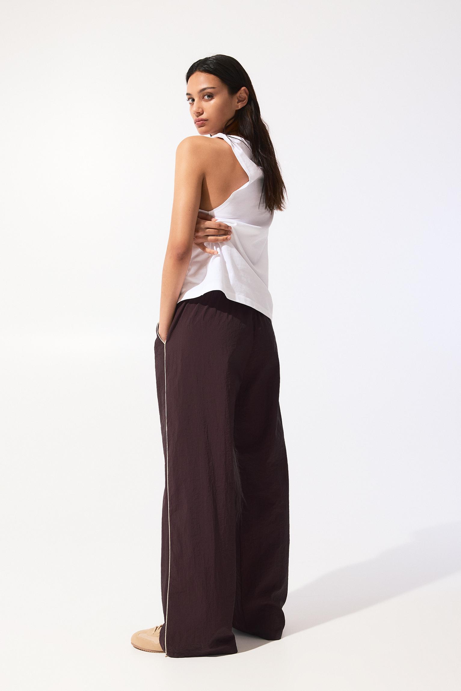 Tracksuit pants with side stripes Product Image