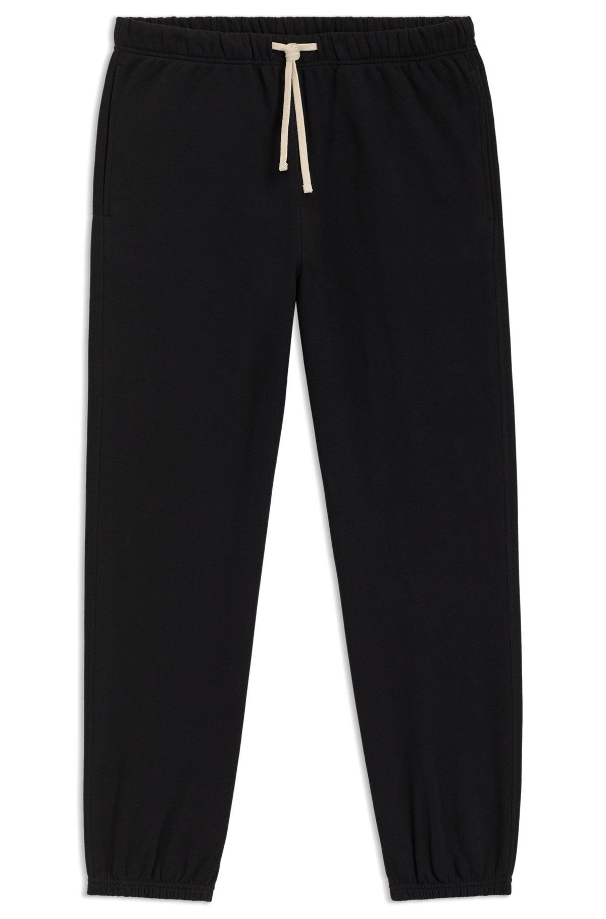 BOSS - BECKHAM x BOSS relaxed tracksuit bottoms in cotton terry - Black Product Image