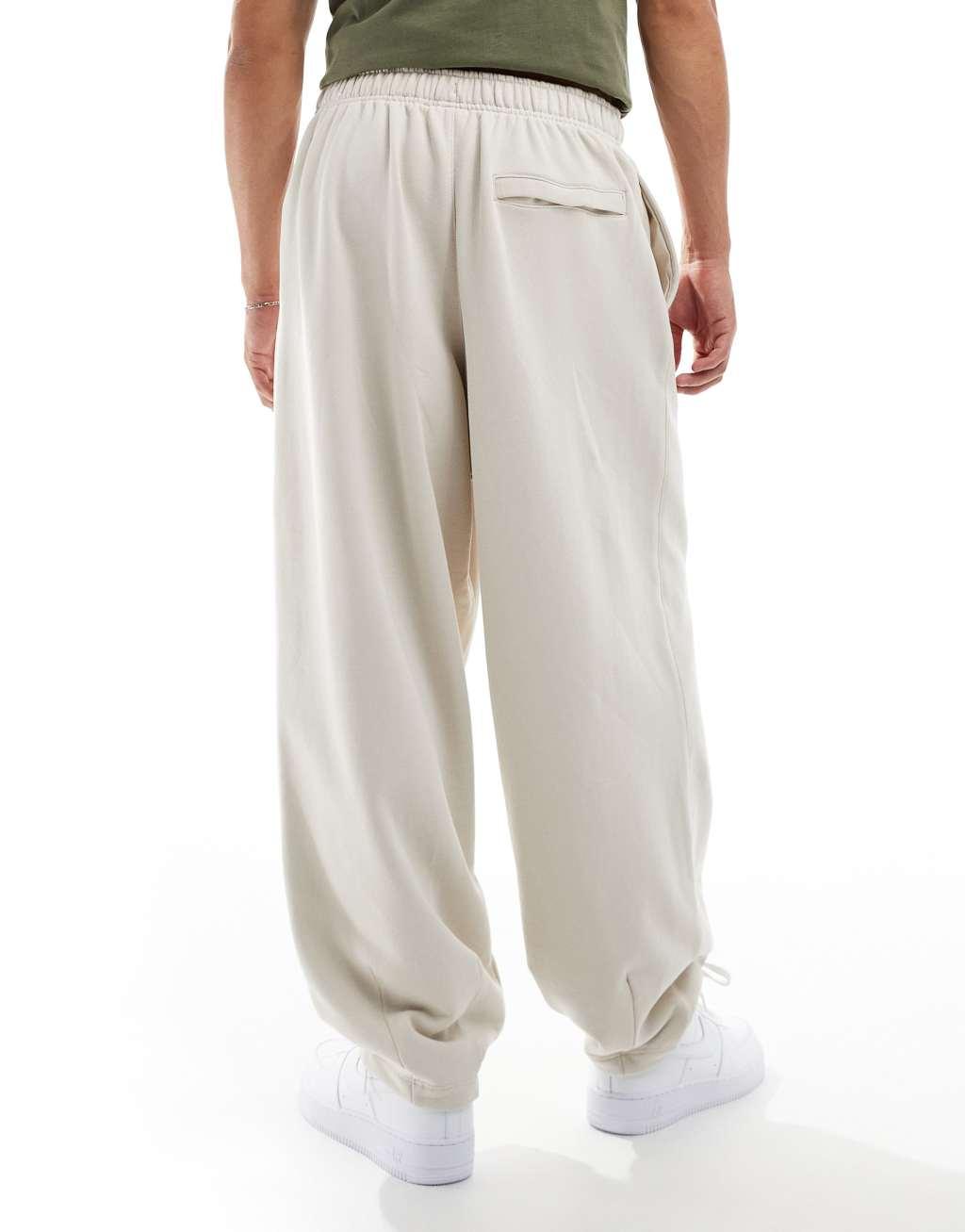 Nike Club oversized sweatpants in beige Product Image