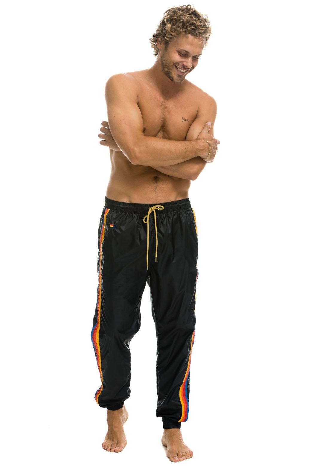 MEN'S 4 STRIPE WIND PANT - BLACK Male Product Image