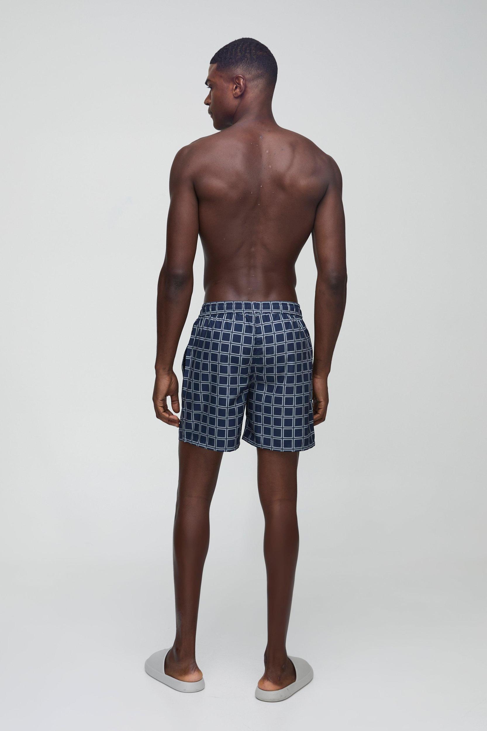 Mid Length Plaid Swim Trunks | boohooMAN USA Product Image