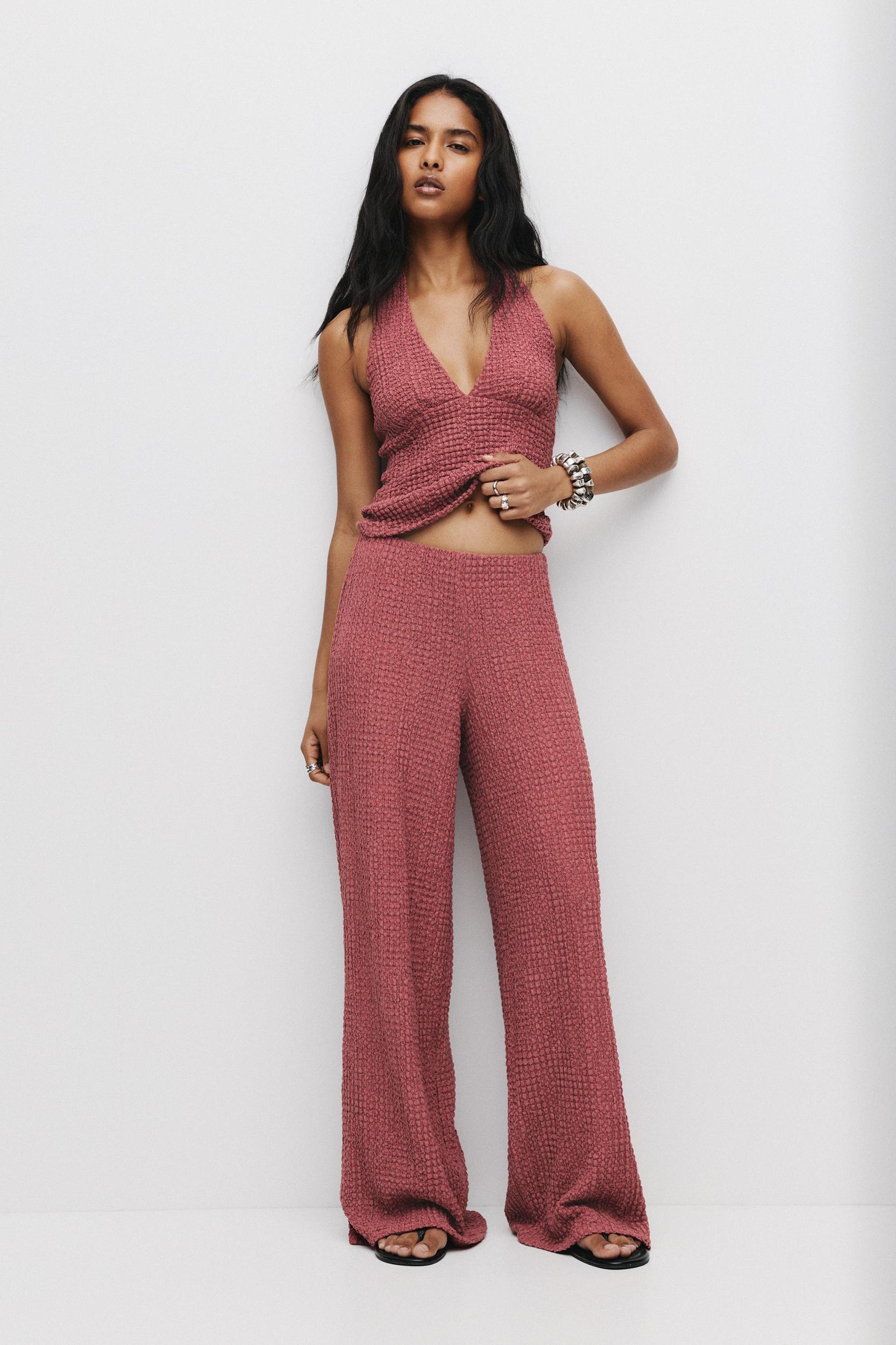 Rustic creased-effect pants Product Image