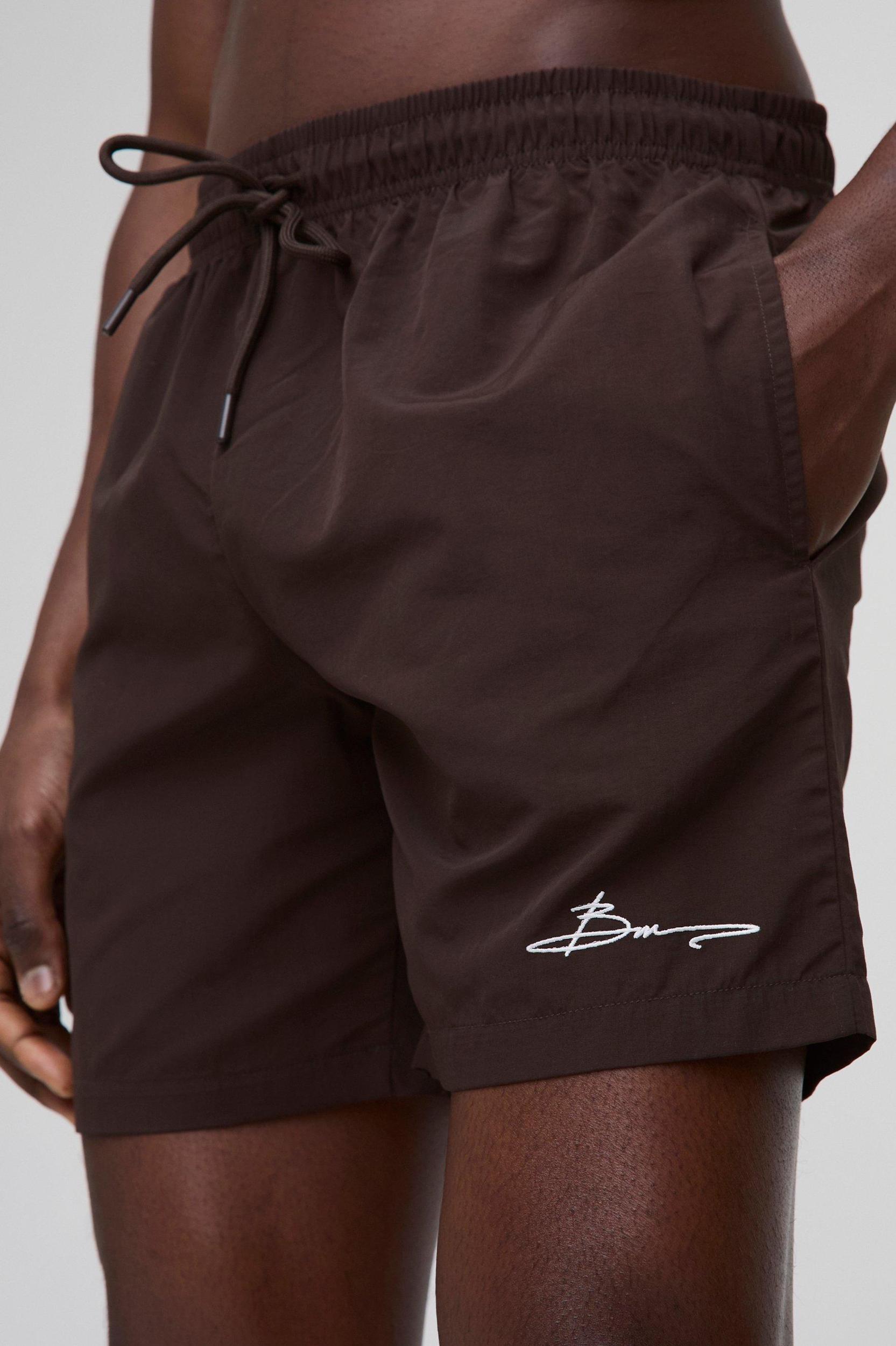 Elasticated Waist Relaxed Short Length Crinkle Nylon Embroidery Shorts | boohooMAN USA Product Image