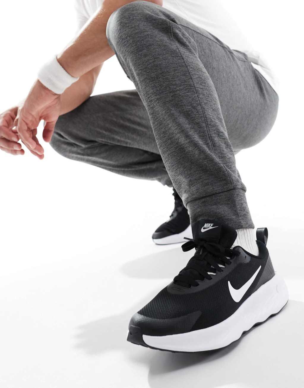 Nike Training Legend Essential 4 sneakers in black and white Product Image