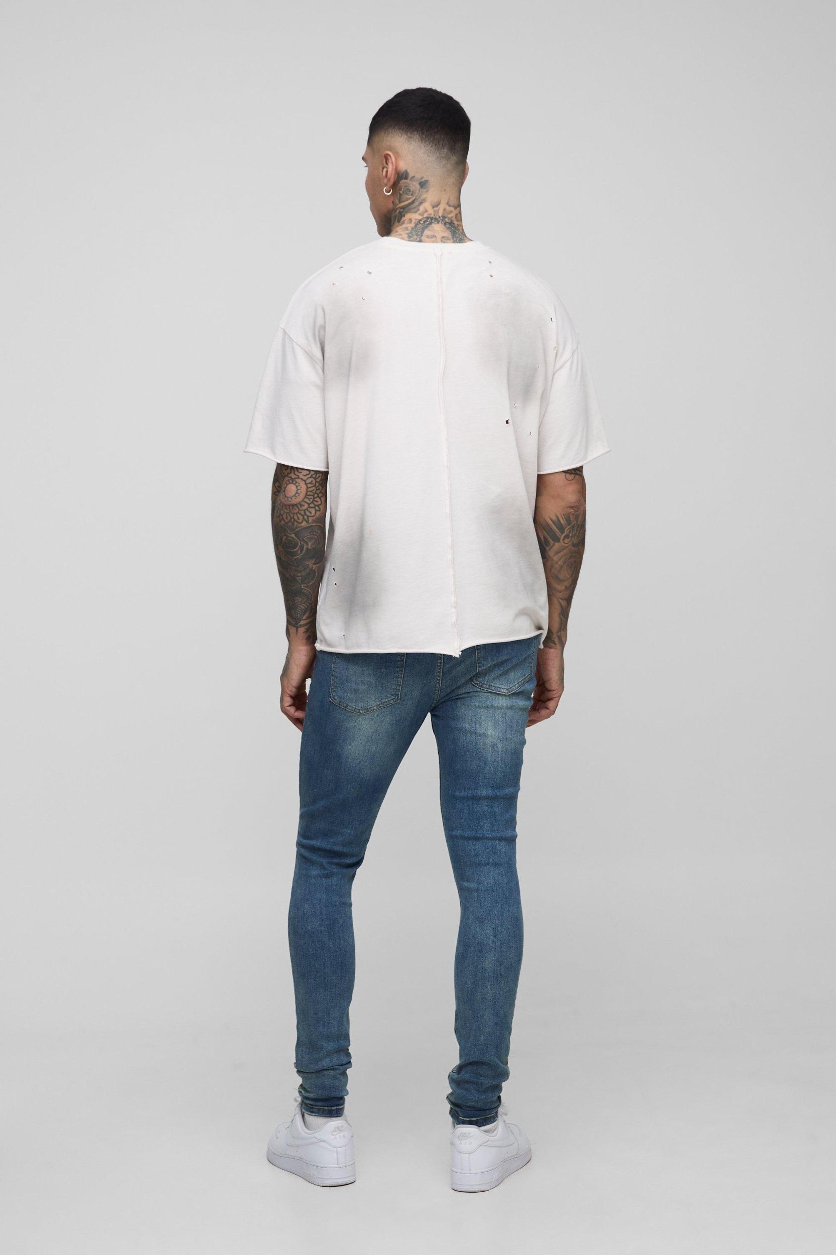 Tall Skinny All Over Ripped Bleached Paint Splatter Jeans | boohooMAN USA Product Image