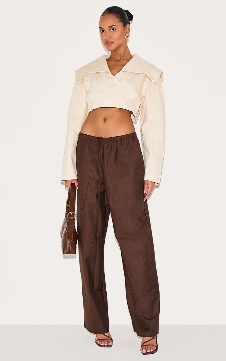 Sand Cross Over Asymmetric Cropped Jacket Product Image