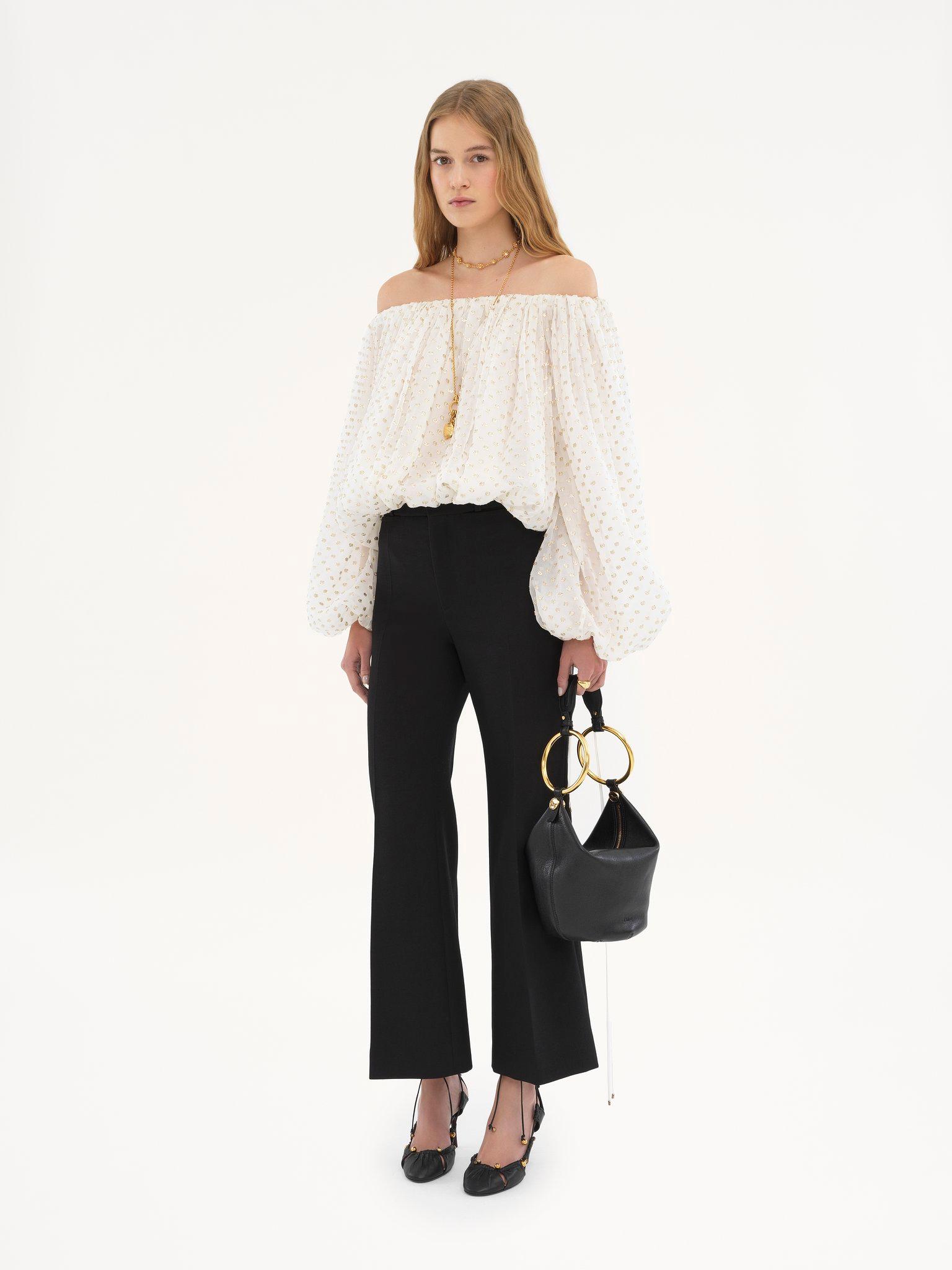 Cropped bootcut pants in wool crêpe Product Image