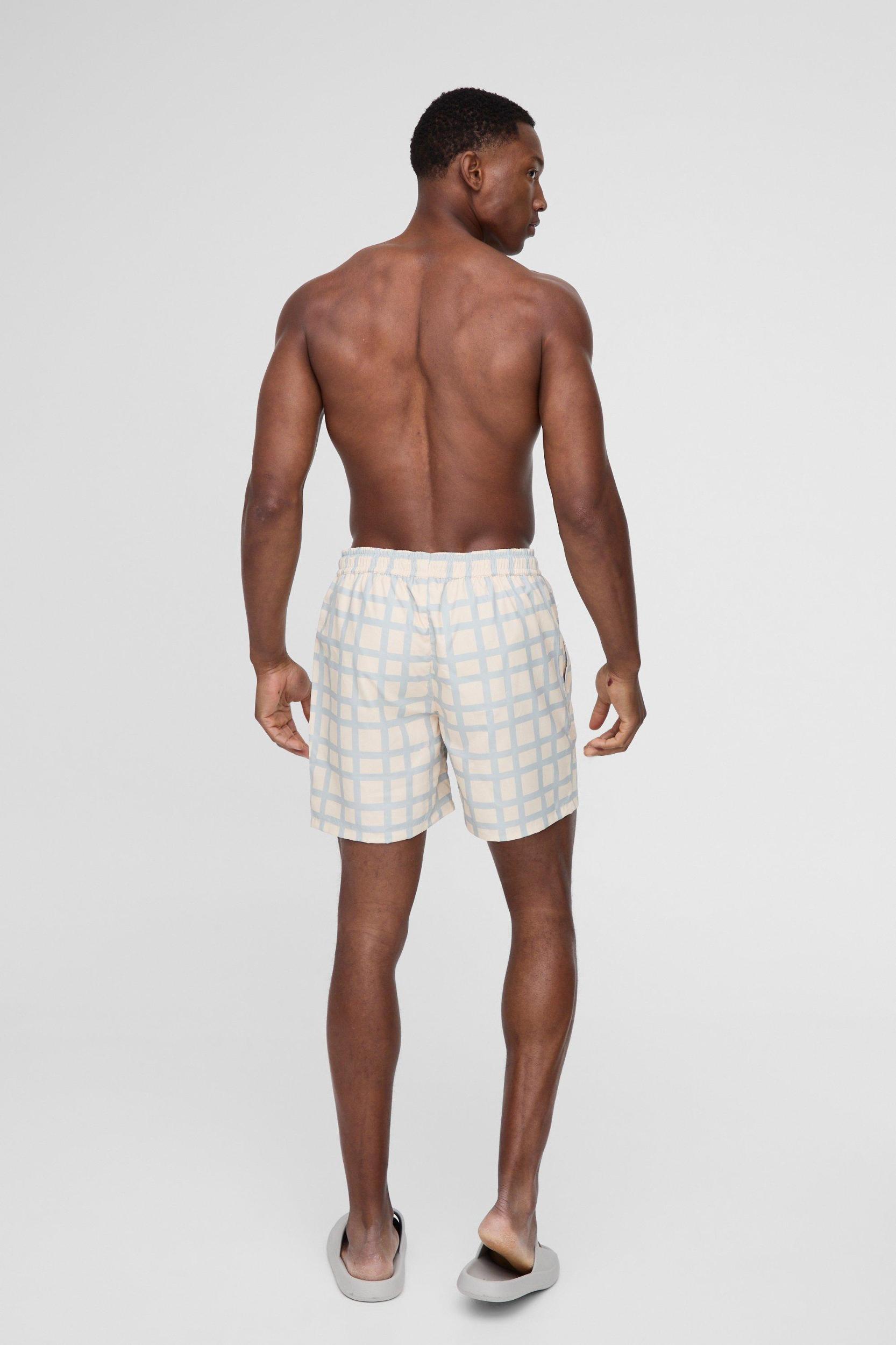 Mid Length Plaid Swim Trunks | boohooMAN USA Product Image