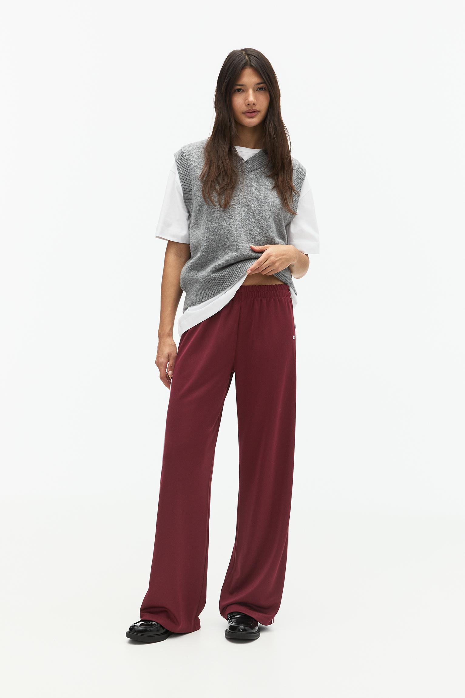 Tracksuit pants with side stripes Product Image