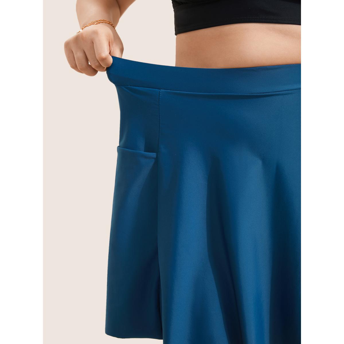 Plus Size Solid Patched Pocket Side Pleated Swim Skirt Women's Swimwear Indigo Beach Non High stretch Bodycon High Rise Slanted pocket Curve Swim Bottoms BloomChic 30/6X Product Image