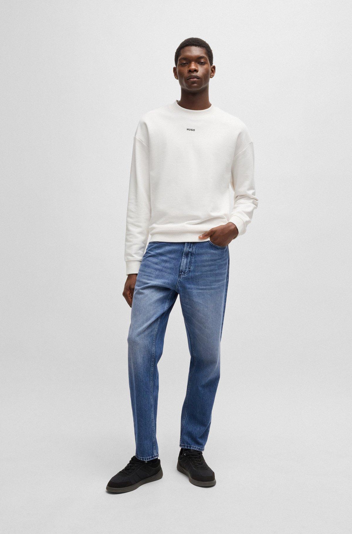 Relaxed tapered-fit jeans in blue vintage-wash denim Product Image