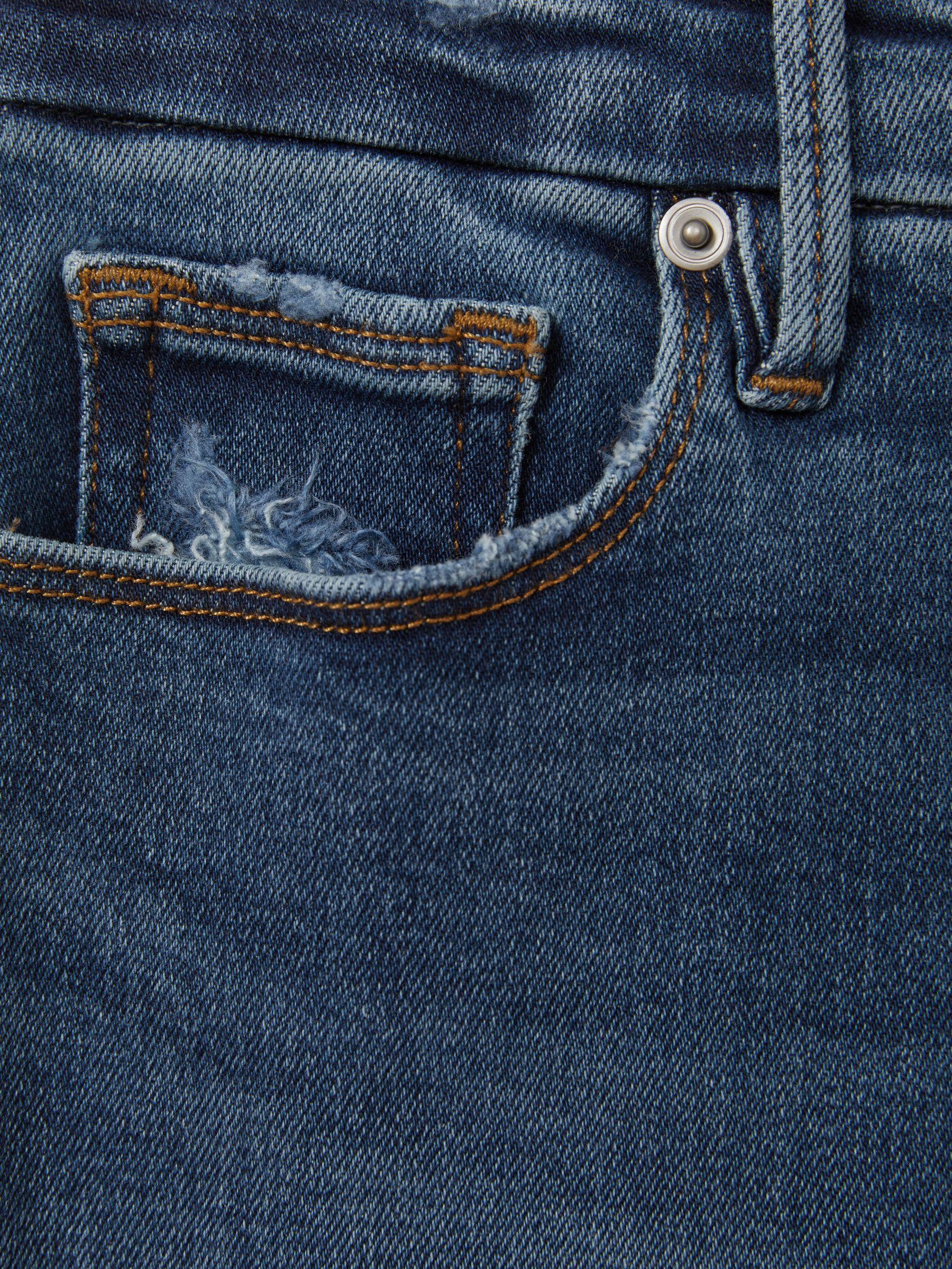 Good American Mid Rise Raw Hem Skinny Jeans in Indigo Product Image