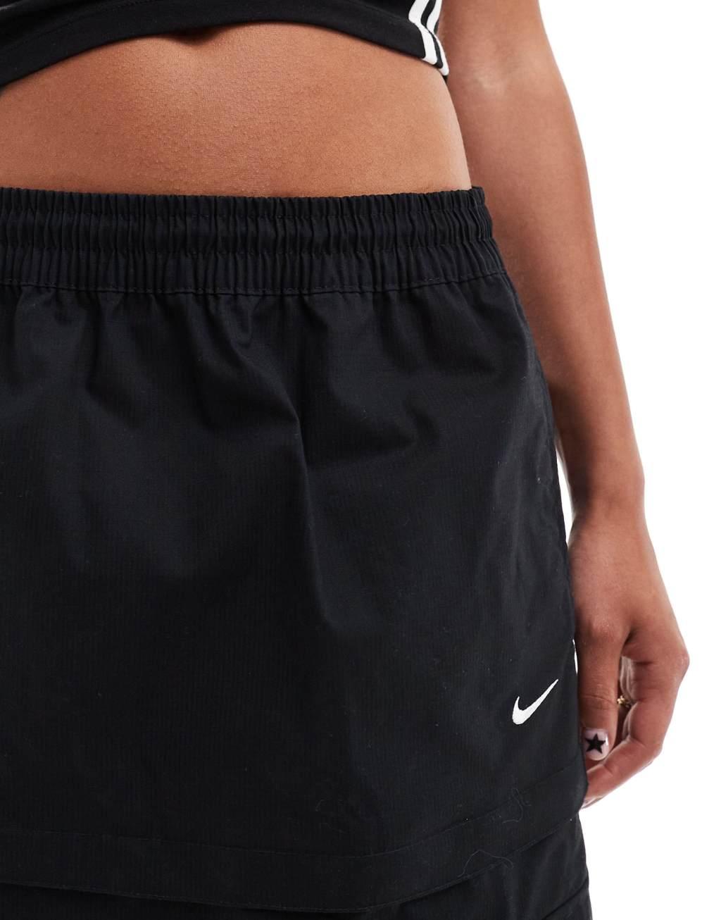 Nike Woven 2 n 1 maxi and mini skirt with zip detail in black Product Image