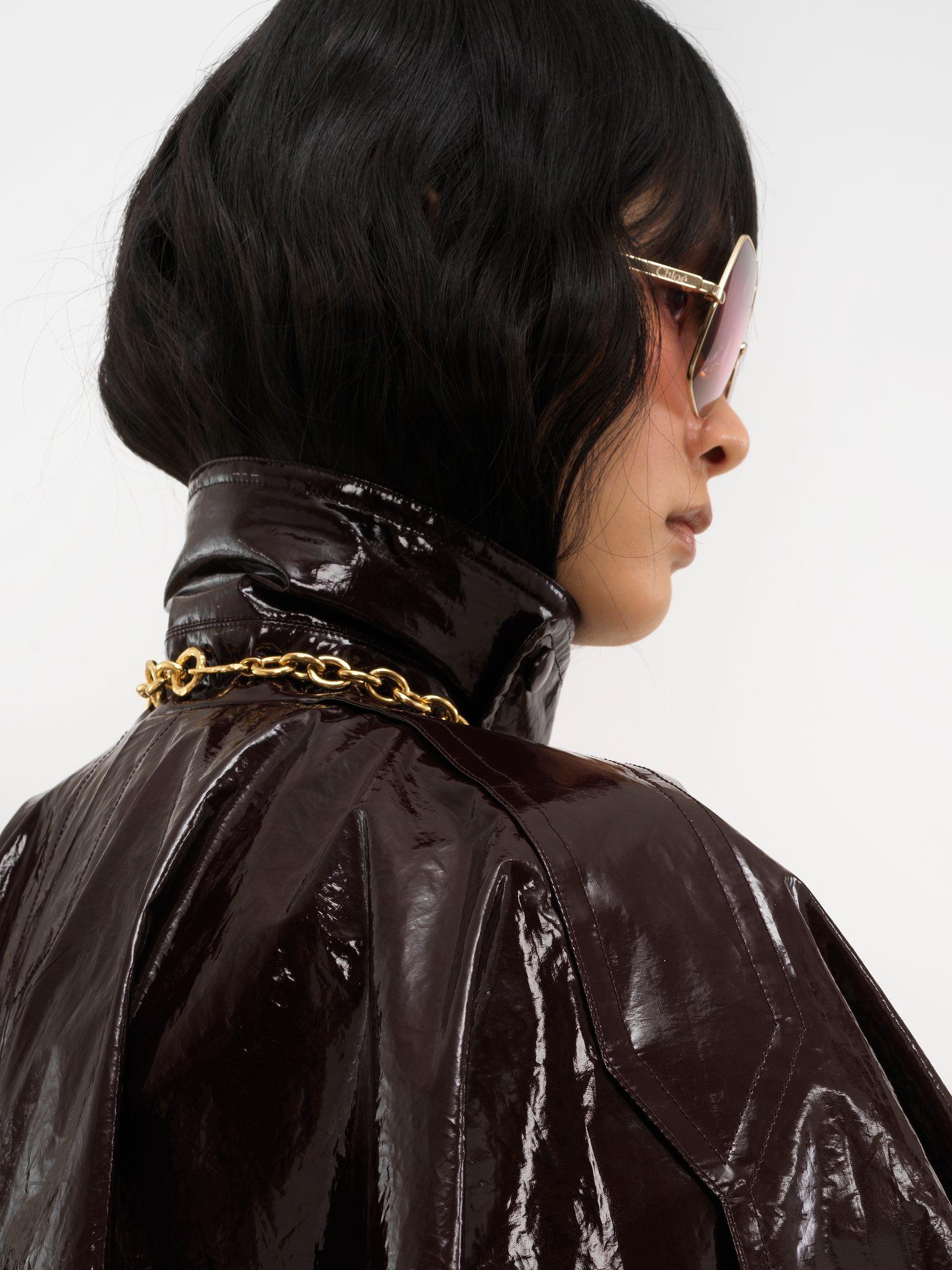 Short cape in lacquered shiny cotton Product Image