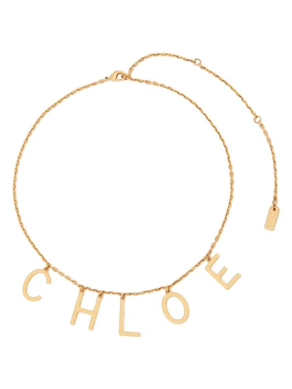 CHLOÉ Metallic Belt With Adjustable Hook Closure And Logo Lettering Charm In Brass Woman In Gold Product Image