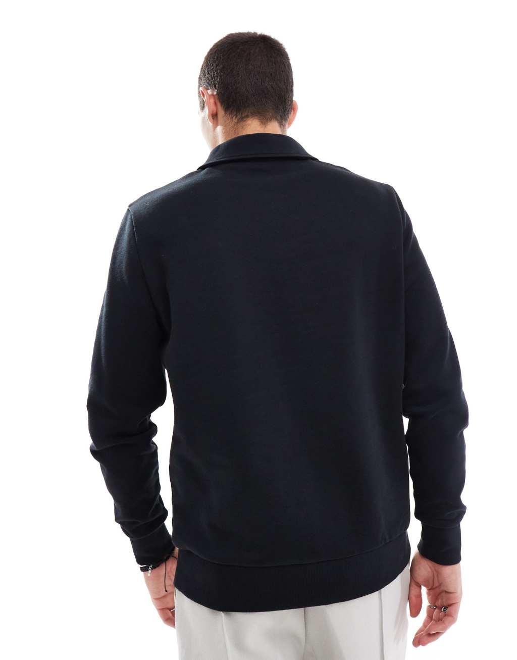 ASOS DESIGN polo sweatshirt with zip in black Product Image