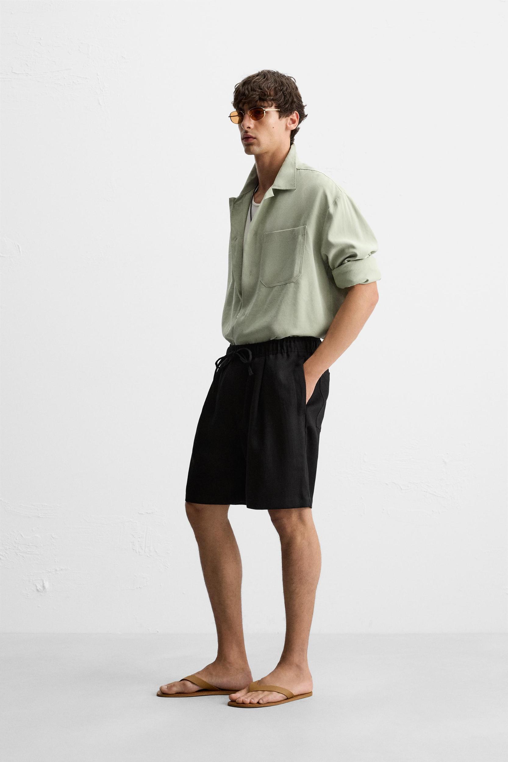 PLEATED FLOWY SHORTS Product Image