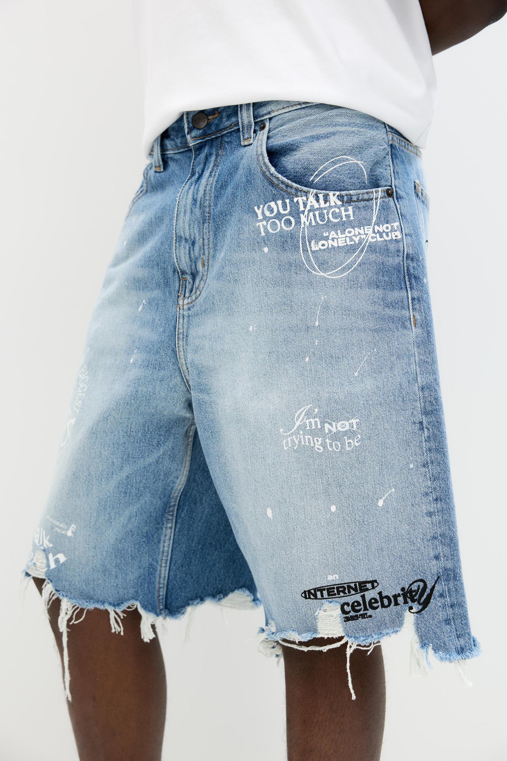 Ripped denim Bermuda shorts Product Image