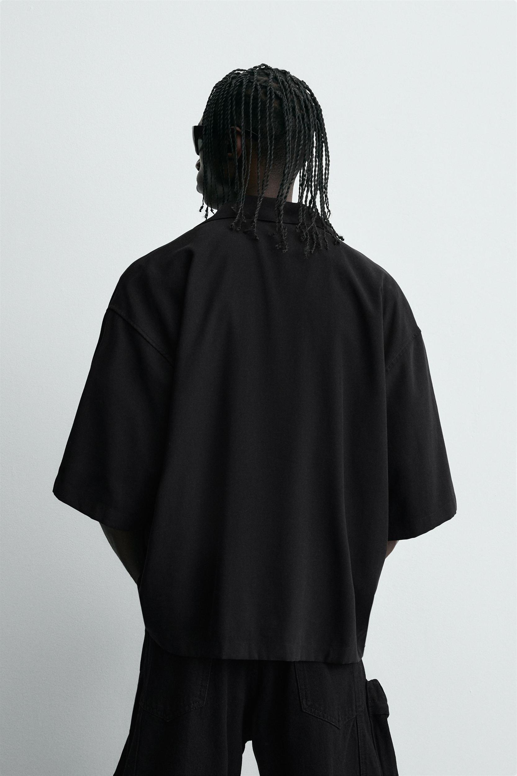 FLOWY SHIRT WITH EMBROIDERED TEXT Product Image