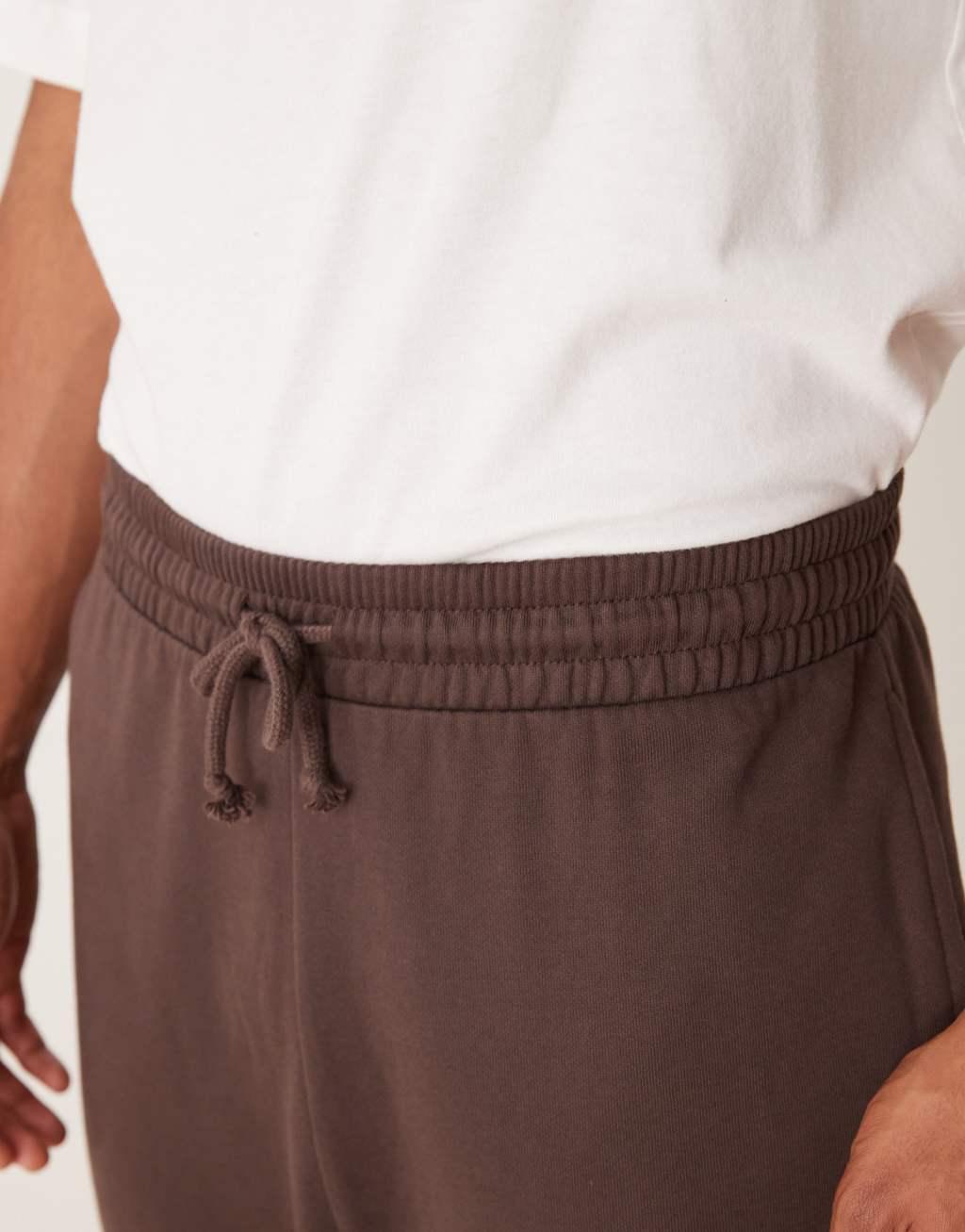 ASOS DESIGN essential oversized sweatpants in brown Product Image