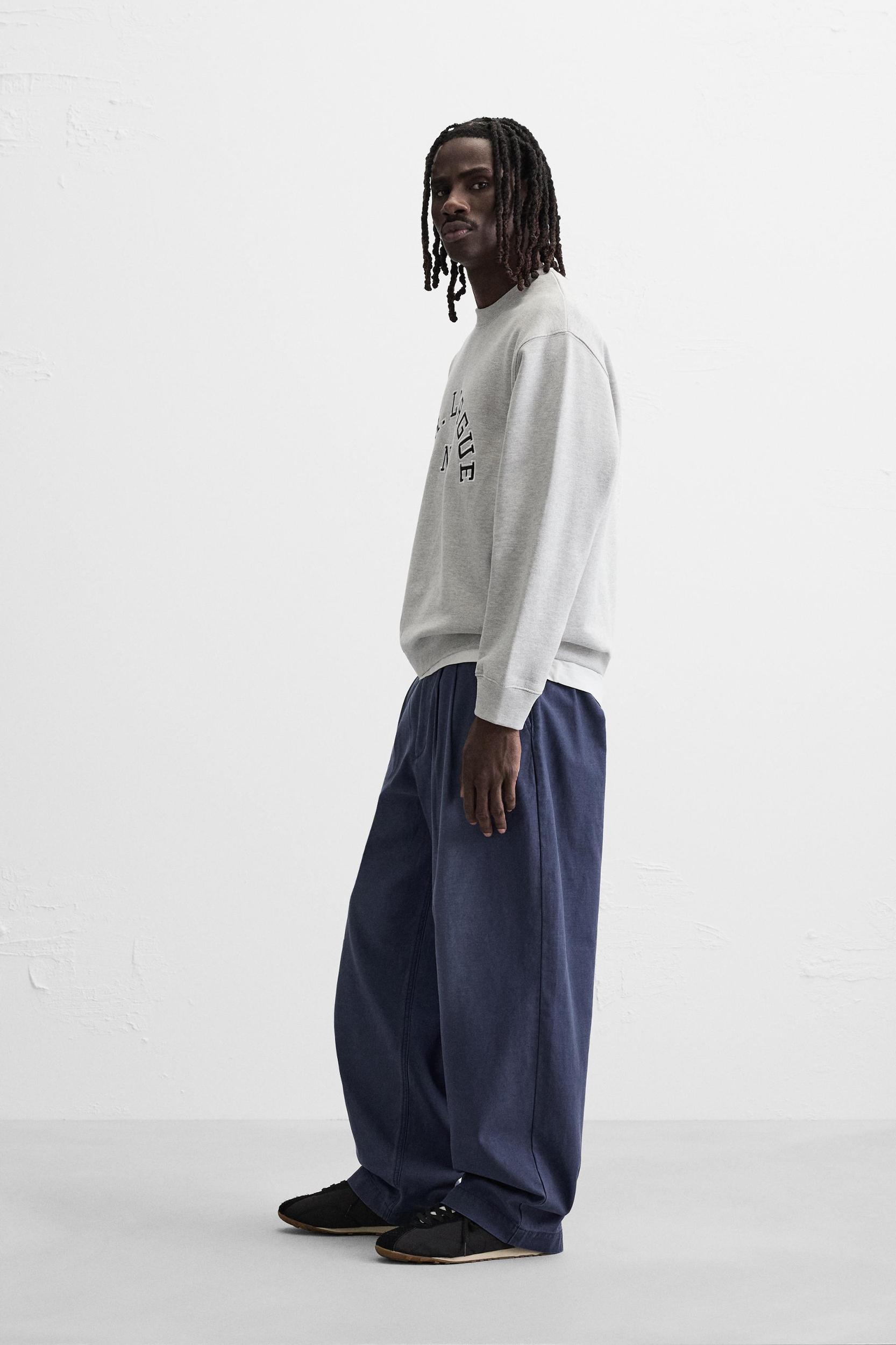 RELAXED FIT PLEATED JEANS Product Image