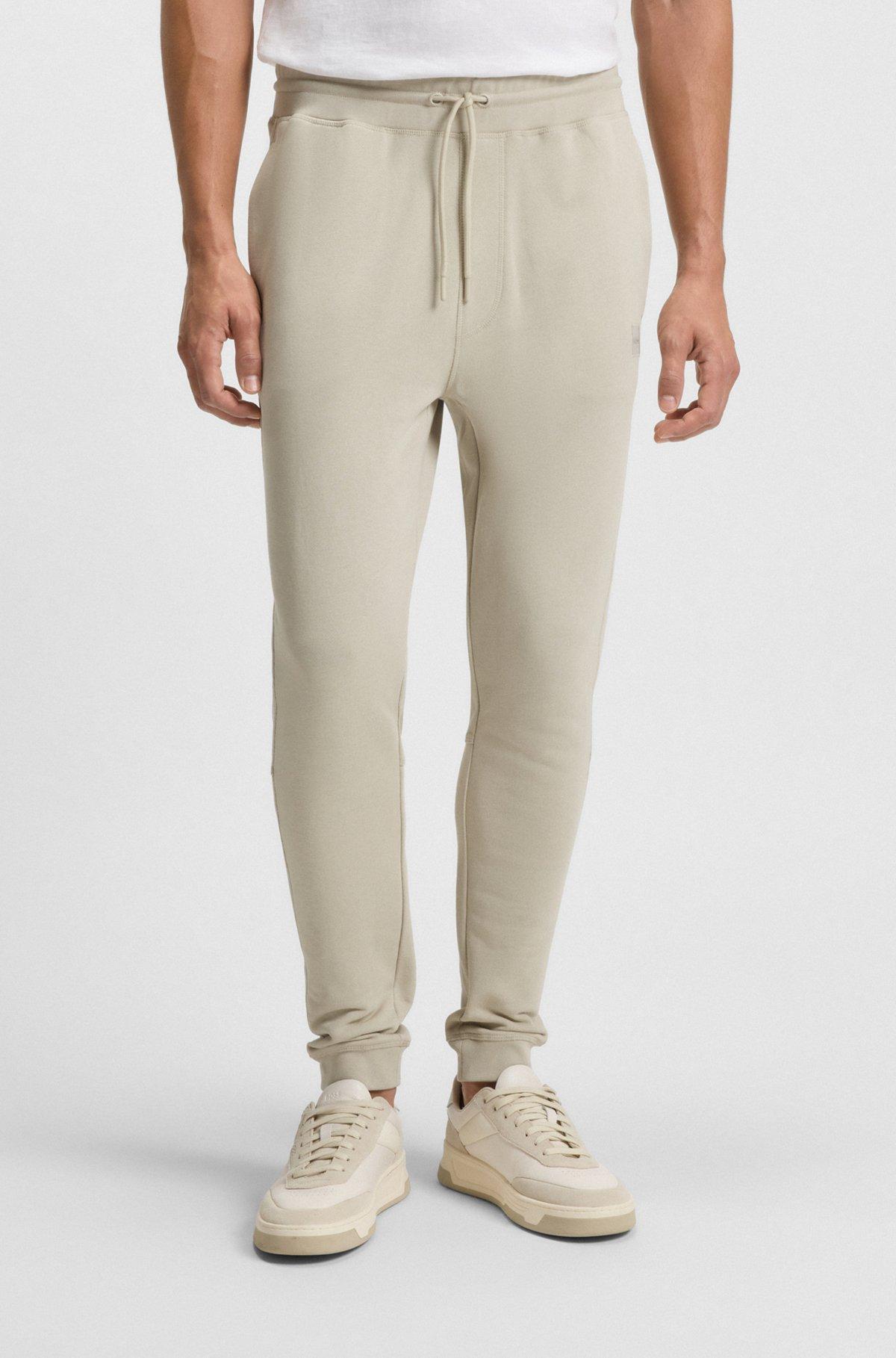 Cotton-terry tracksuit bottoms with logo patch Product Image