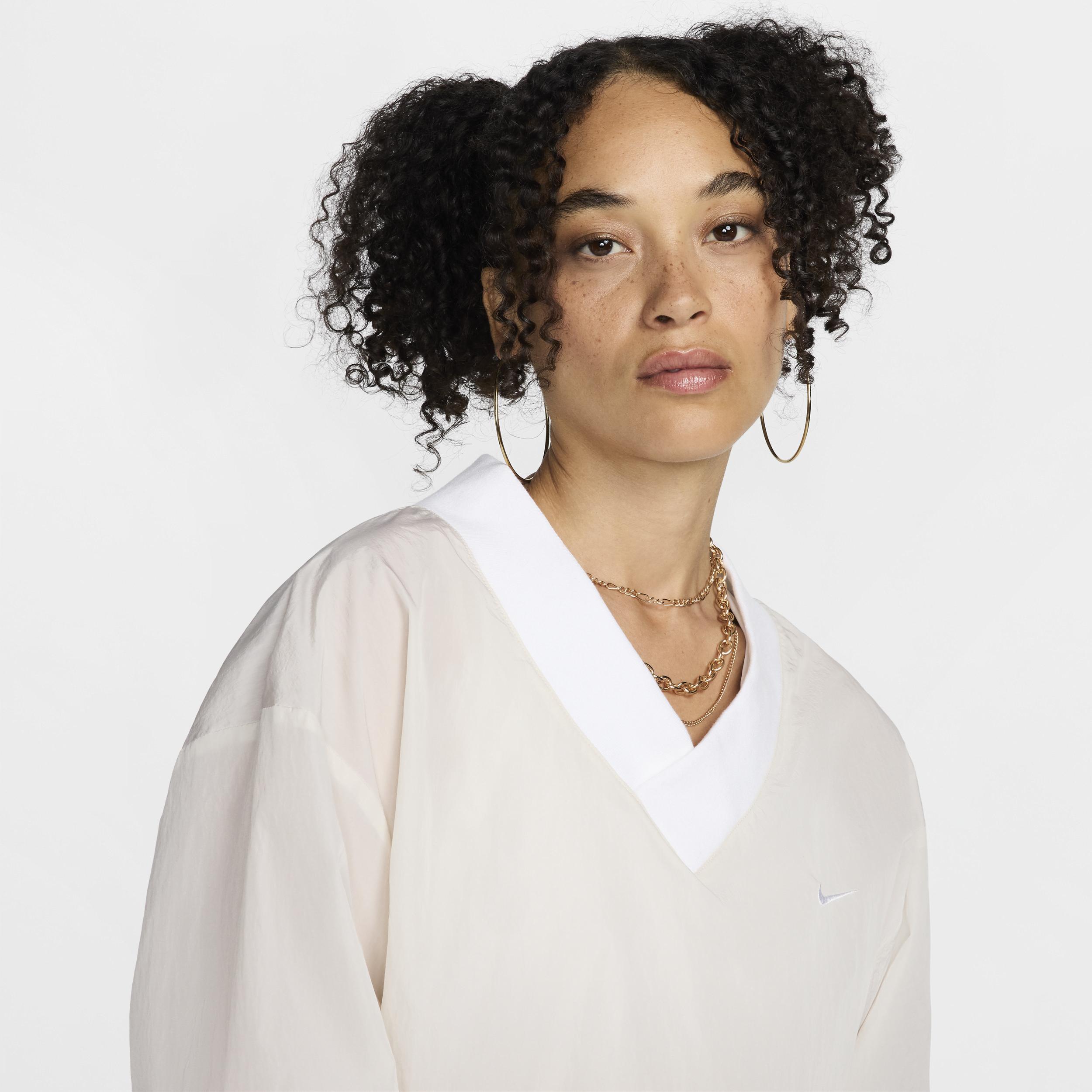 Womens Nike Sportswear Essential Loose UV Woven Long-Sleeve V-Neck Top | FV7649-110 Product Image