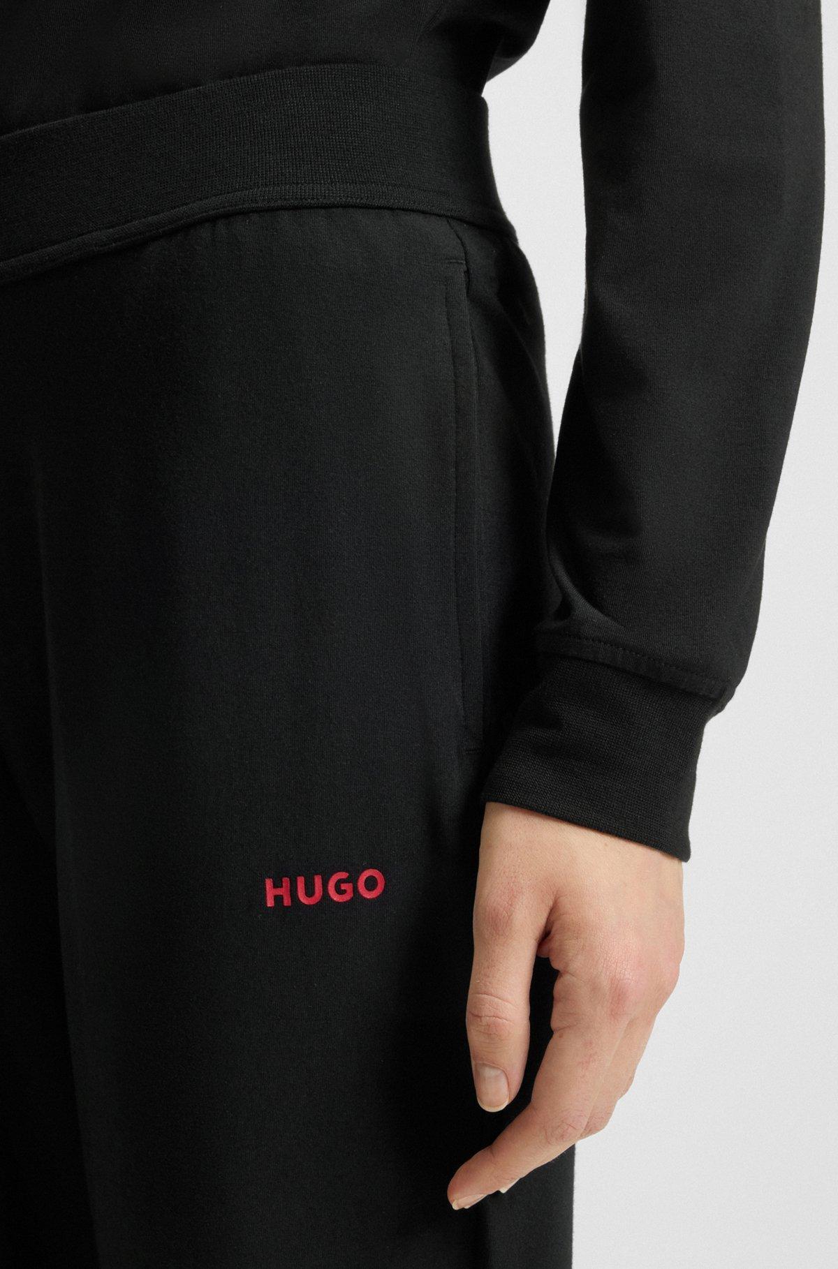 Relaxed-fit tracksuit bottoms with printed logo Product Image