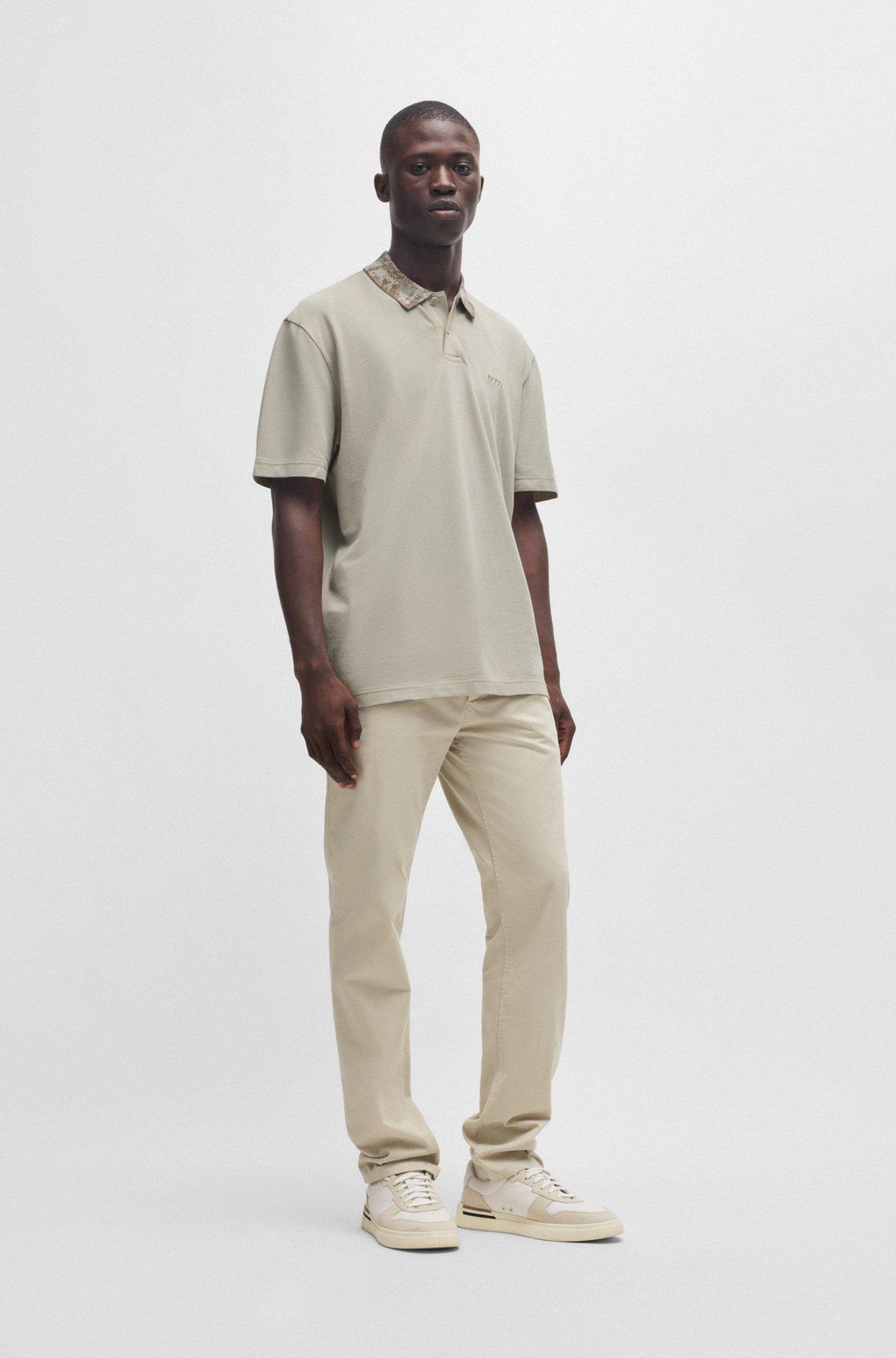 Cotton-piqué polo shirt with jungle-artwork collar Product Image