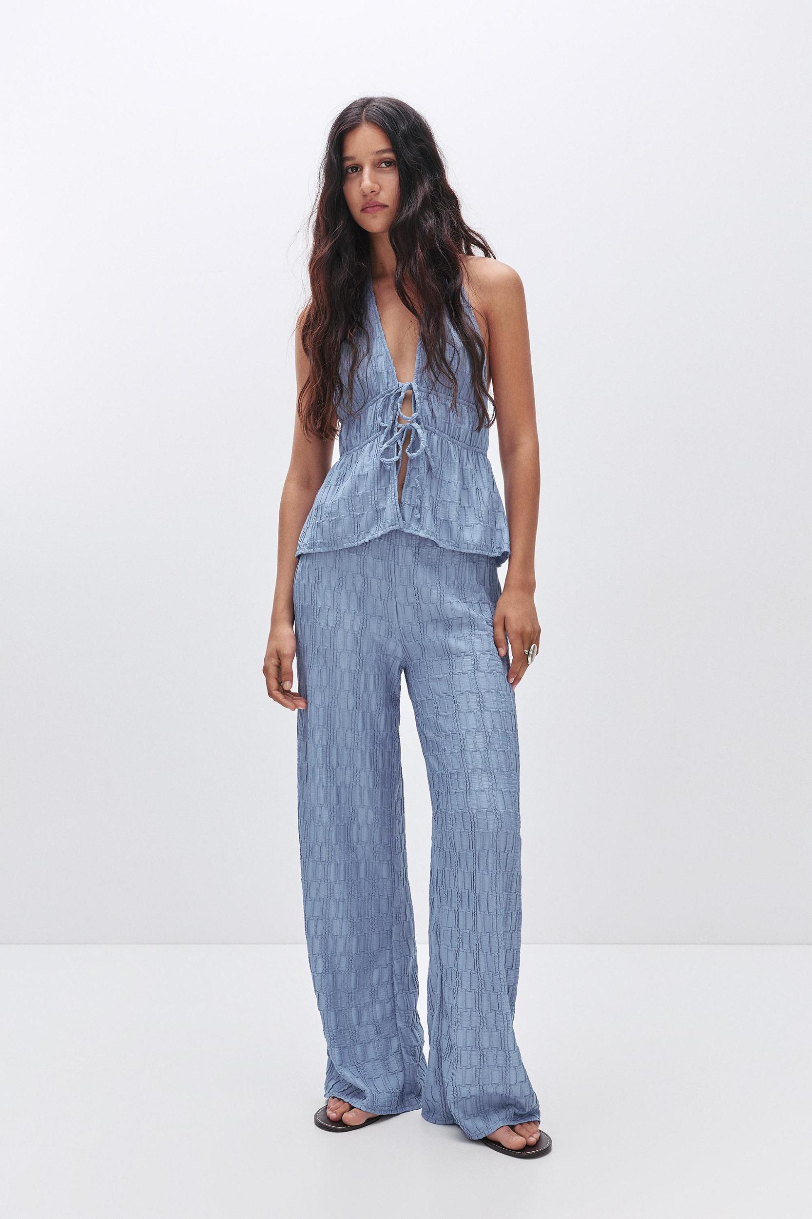 Textured bell bottom trousers Product Image