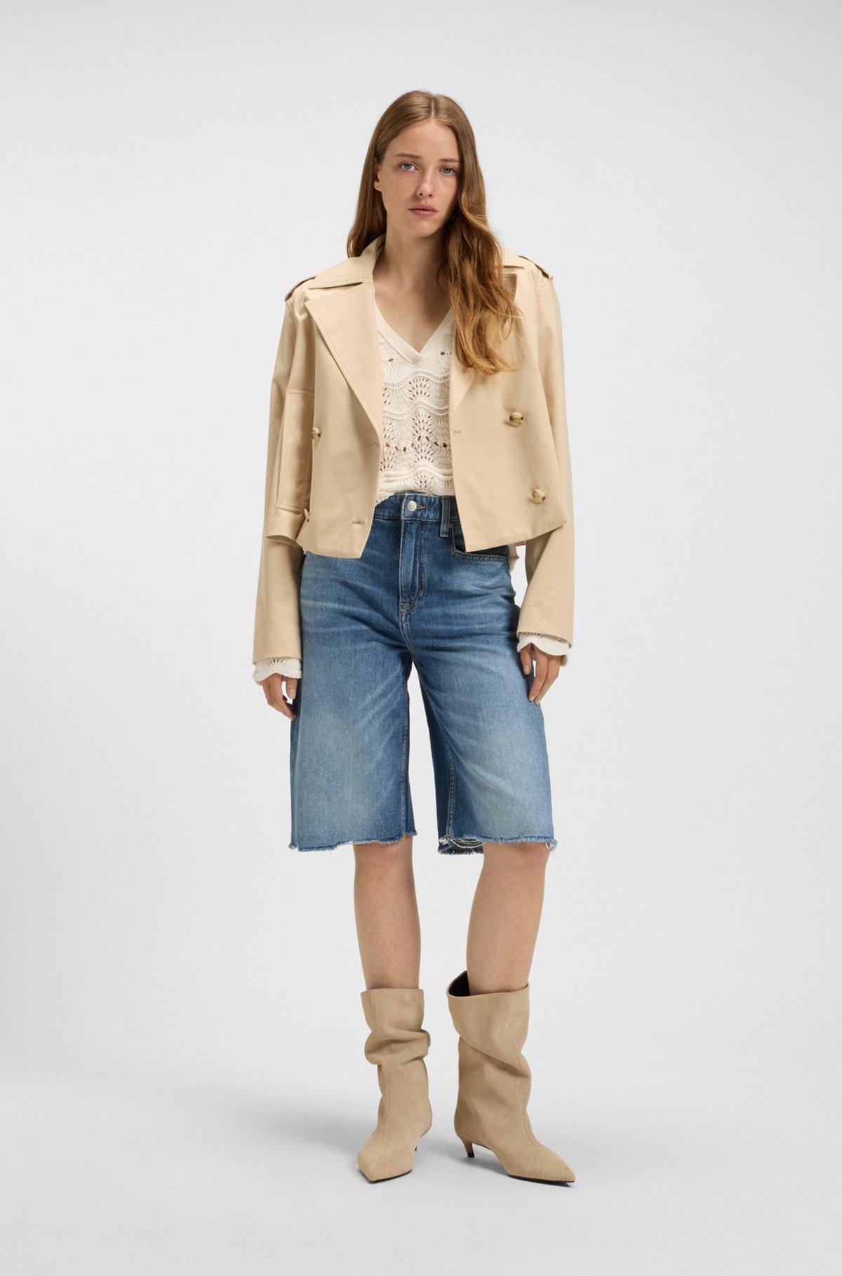 Knee-length denim shorts with raw hem Product Image