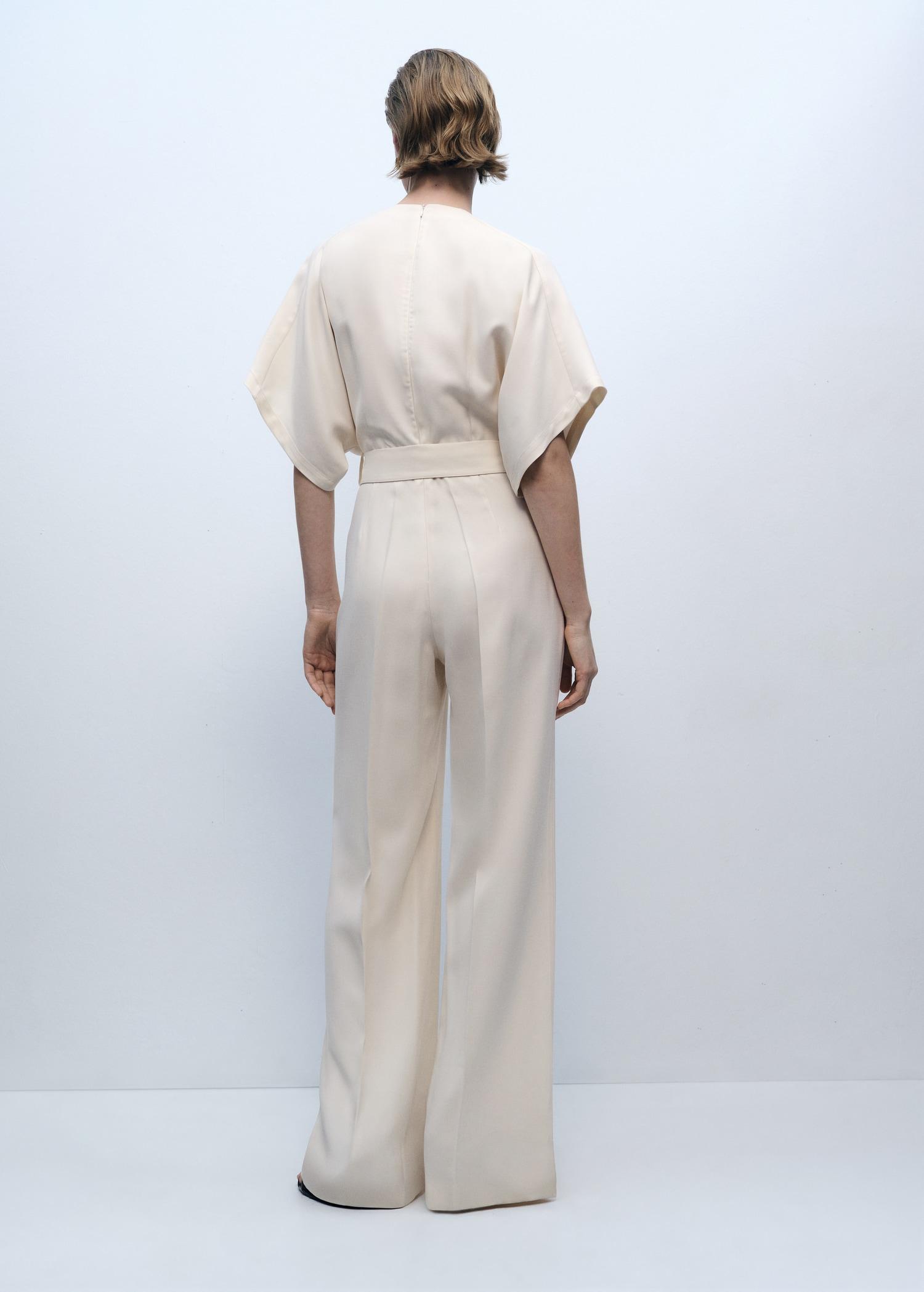 Long jumpsuit with belt and buckle - Women | MANGO USA Product Image