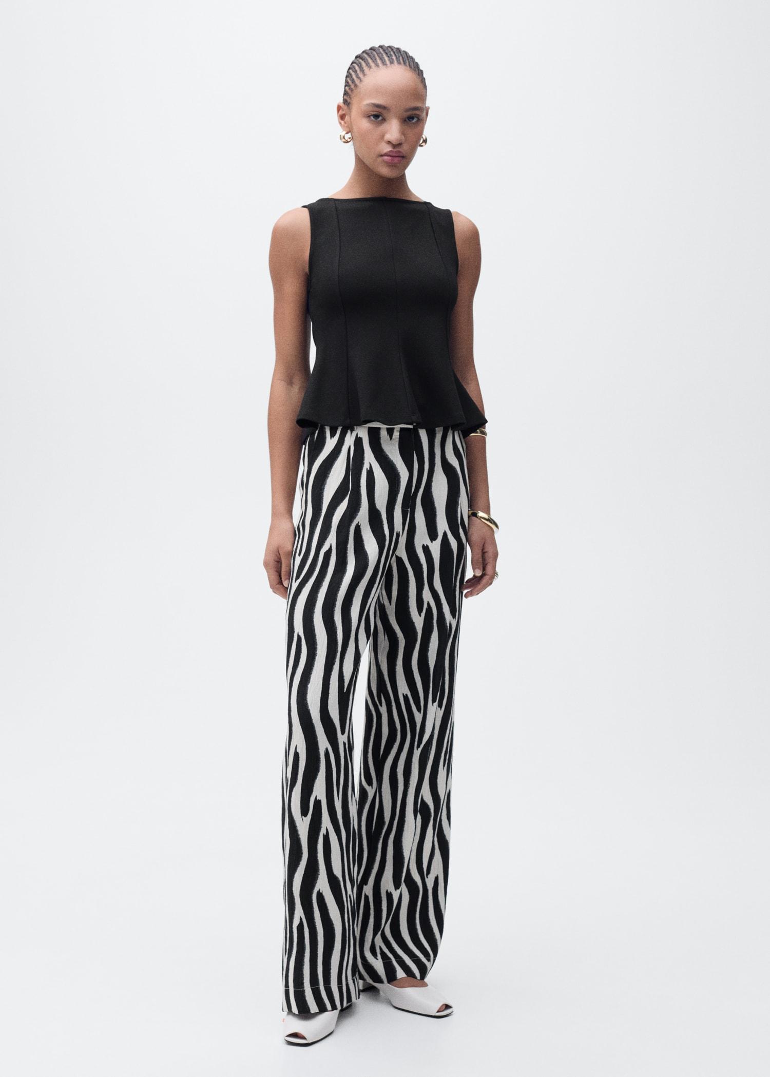 Peplum top with seam detail - Women | MANGO USA Product Image