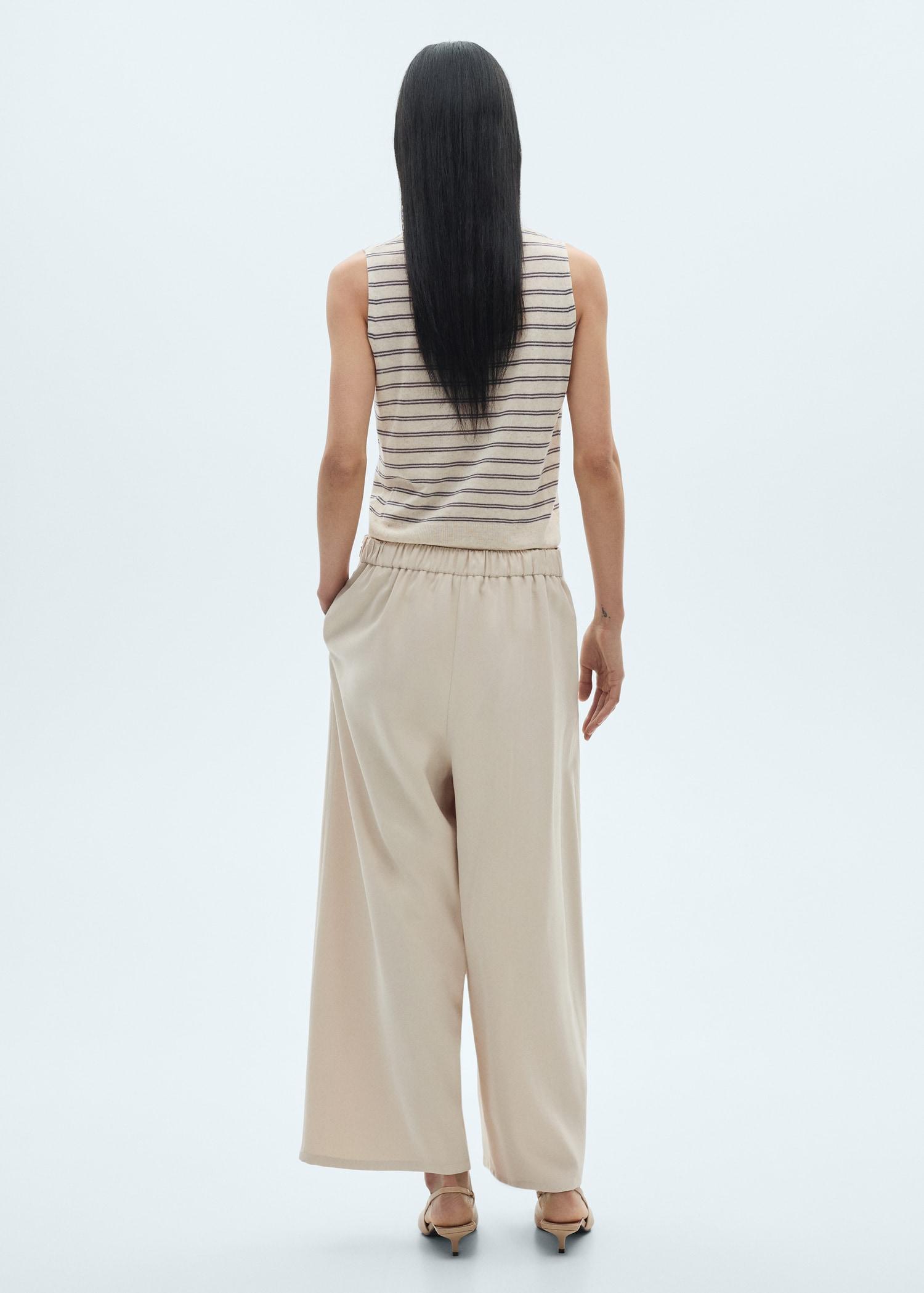 Wide-leg pleated pants - Women | MANGO USA Product Image