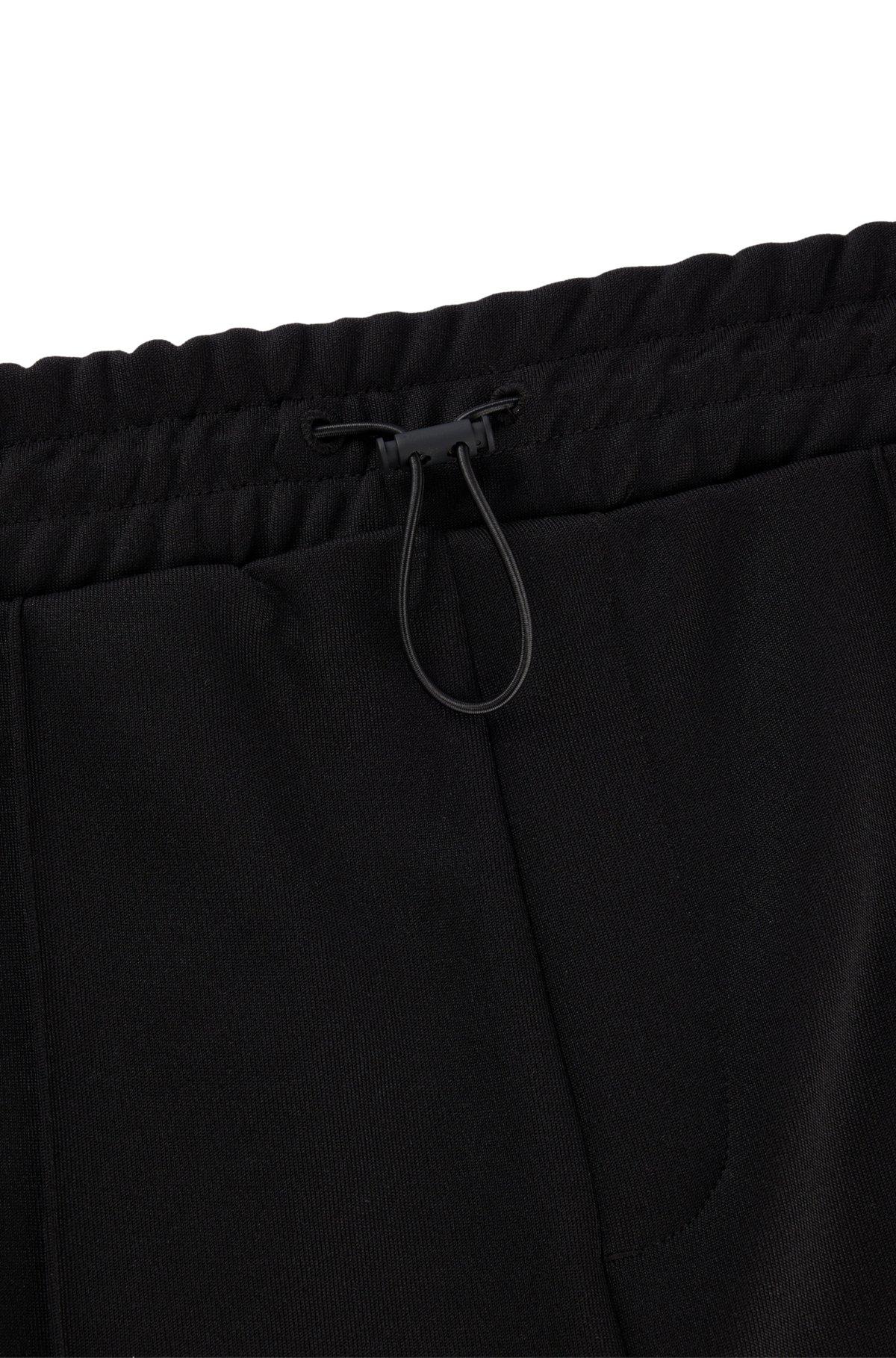 Relaxed-fit tracksuit bottoms with color-blocking Product Image