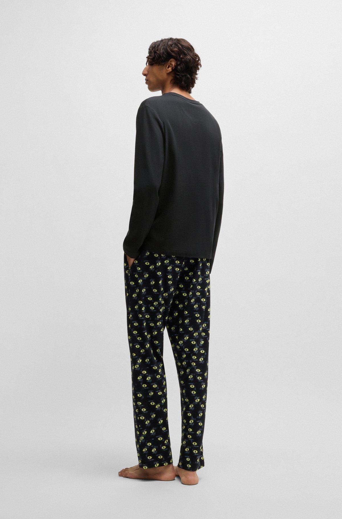 Stretch-cotton pajamas with 70s film graphics Product Image