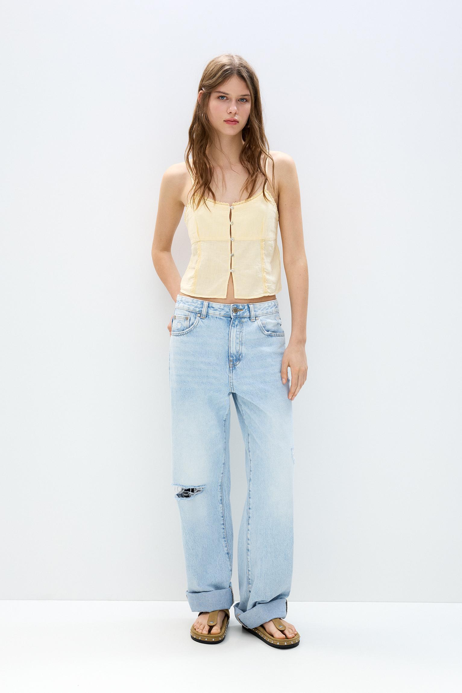 Lace-trimmed top with straps Product Image