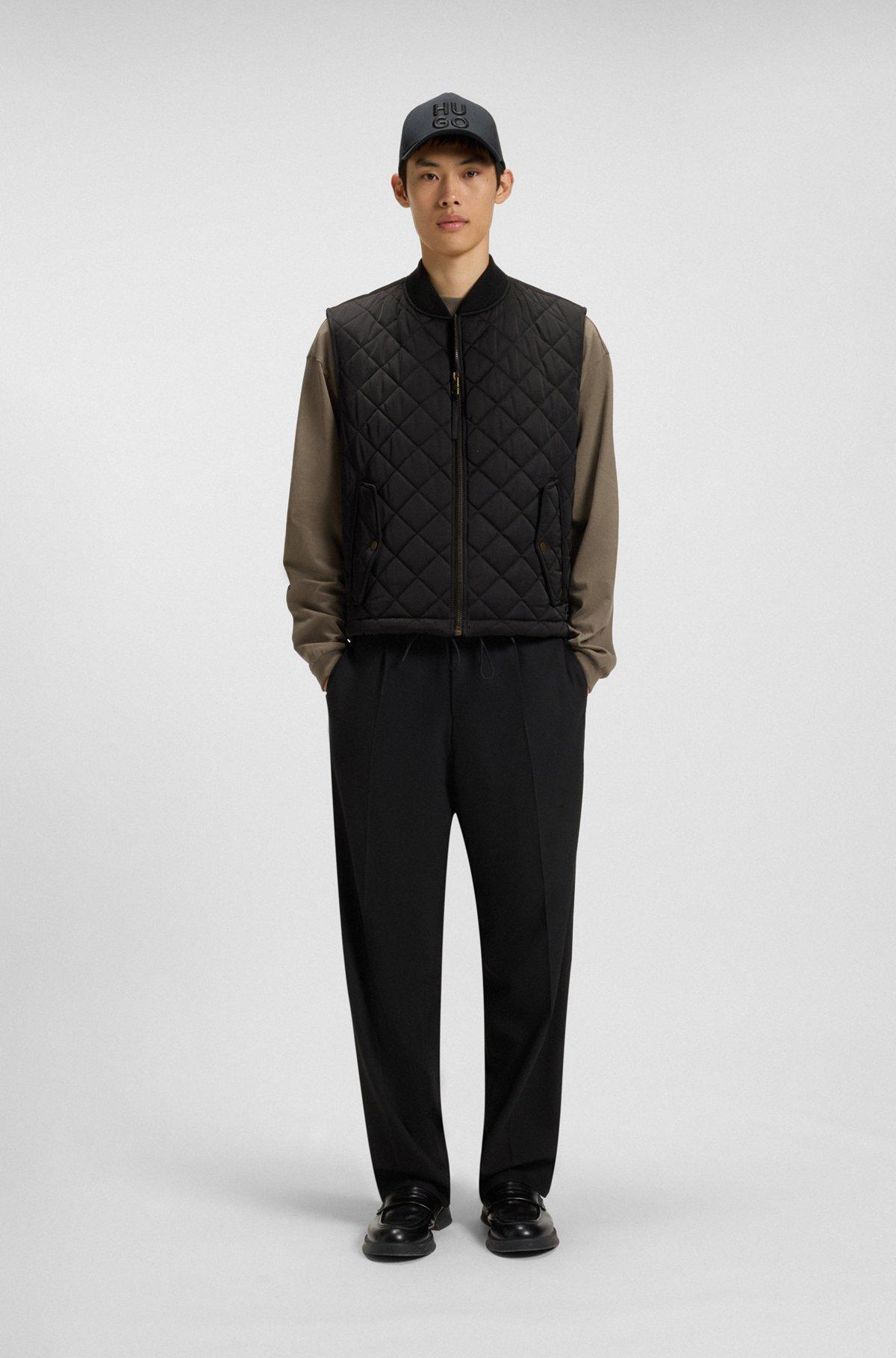 Water-repellent gilet in quilted satin with logo plaque Product Image