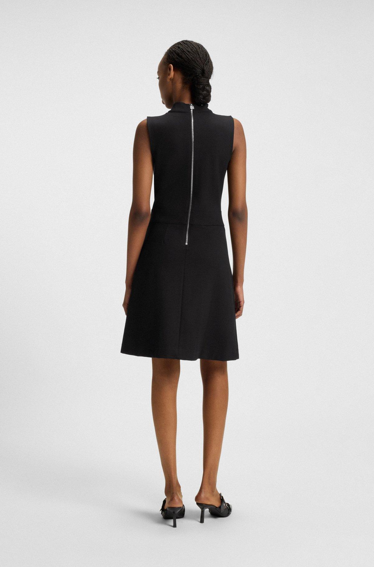 Sleeveless knitted dress with pleated skirt Product Image