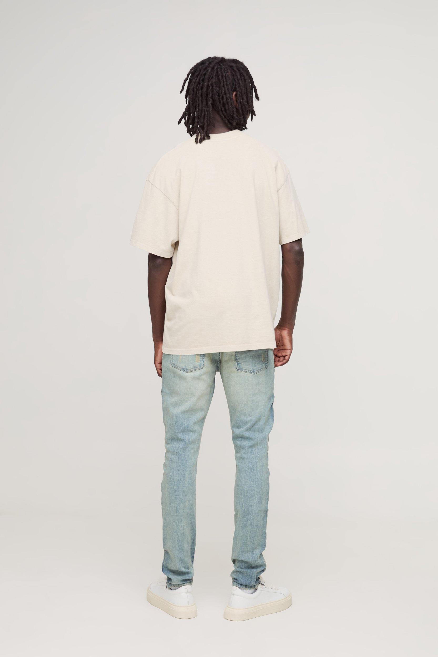 Biker Rip & Repair Stonewash Zip Hem Skinny Jeans | boohooMAN USA Product Image