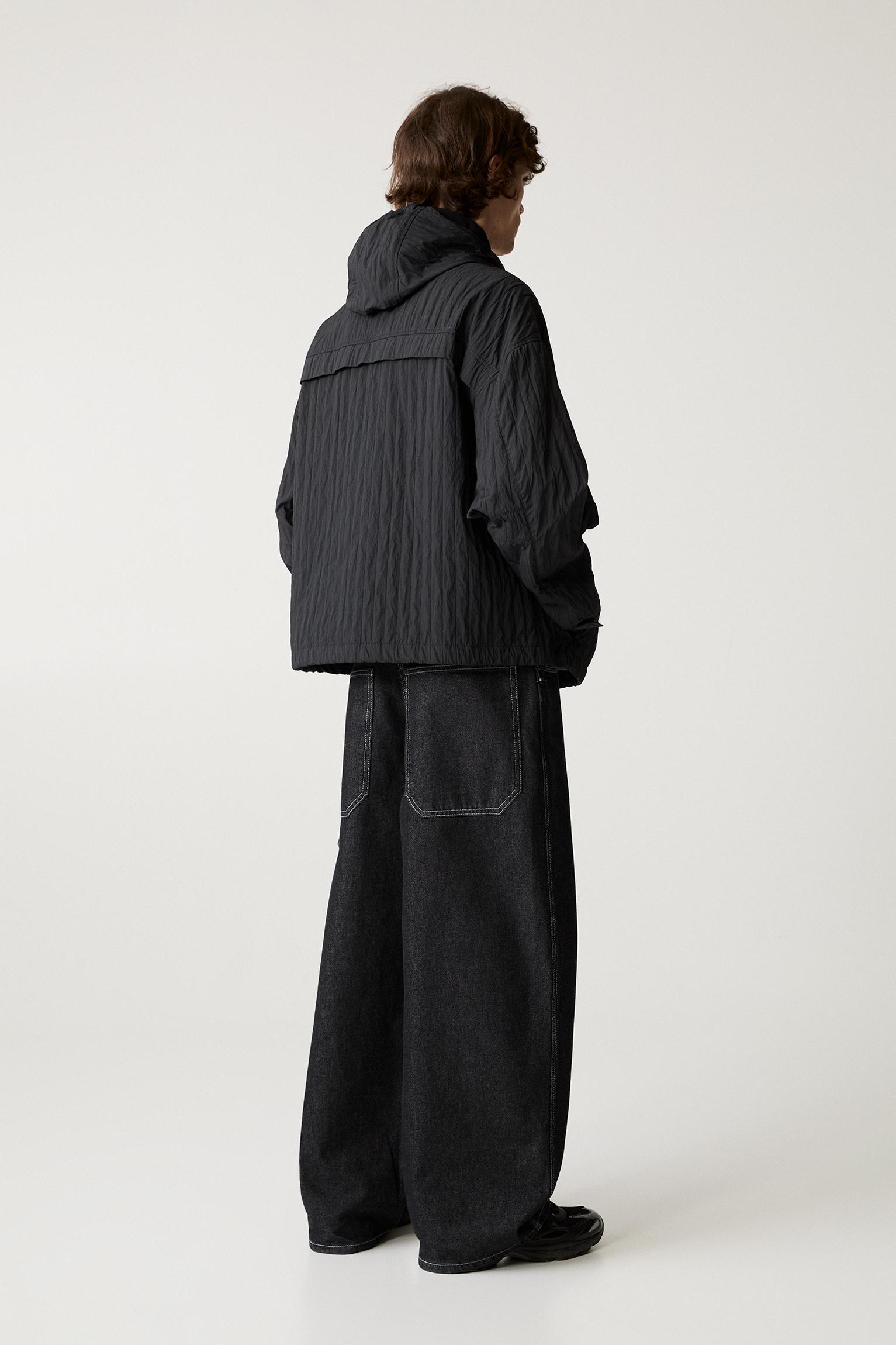 Creased raincoat with hood Product Image