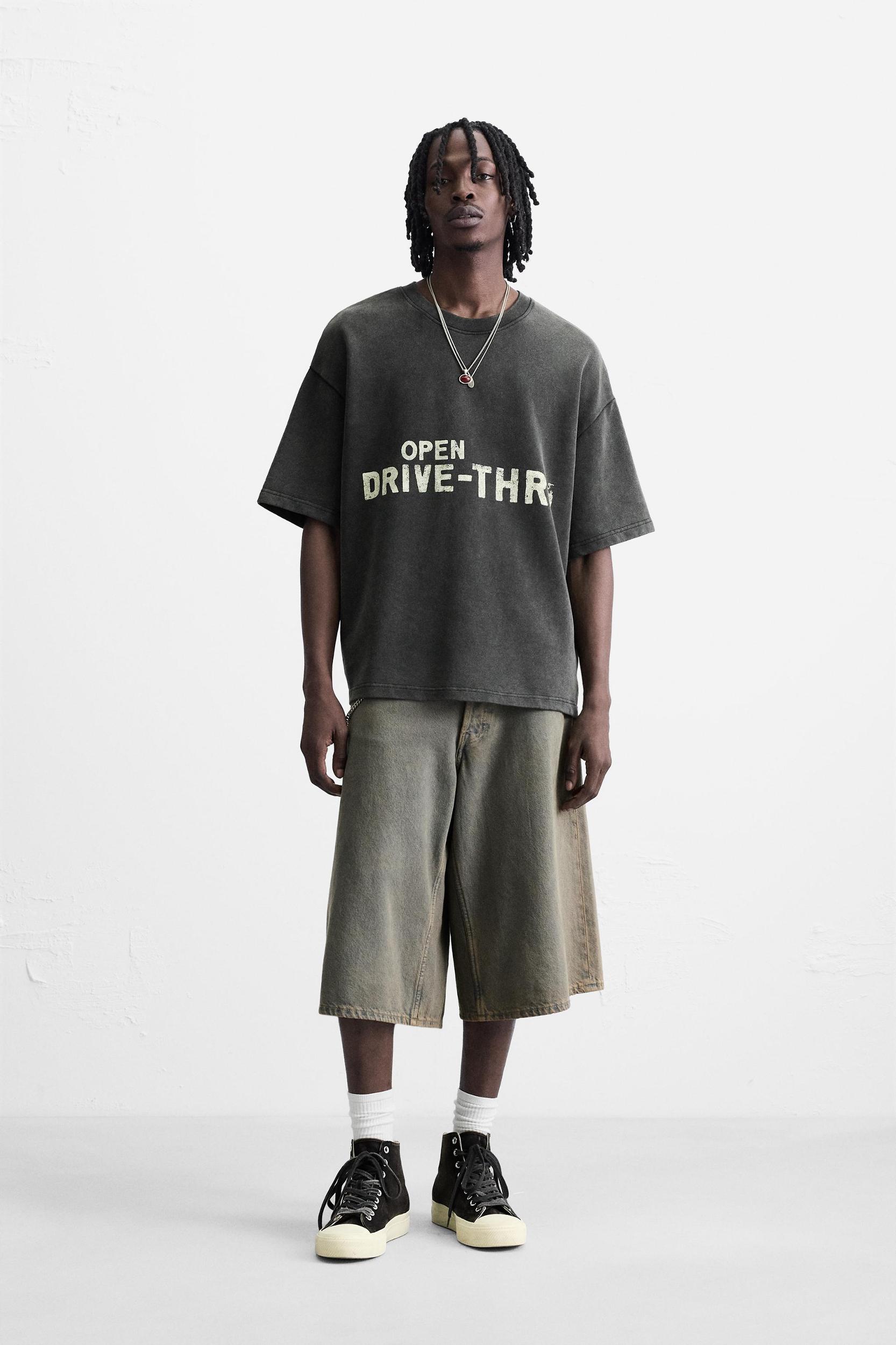 WASHED SWEATSHIRT WITH GRAPHIC PRINTS Product Image