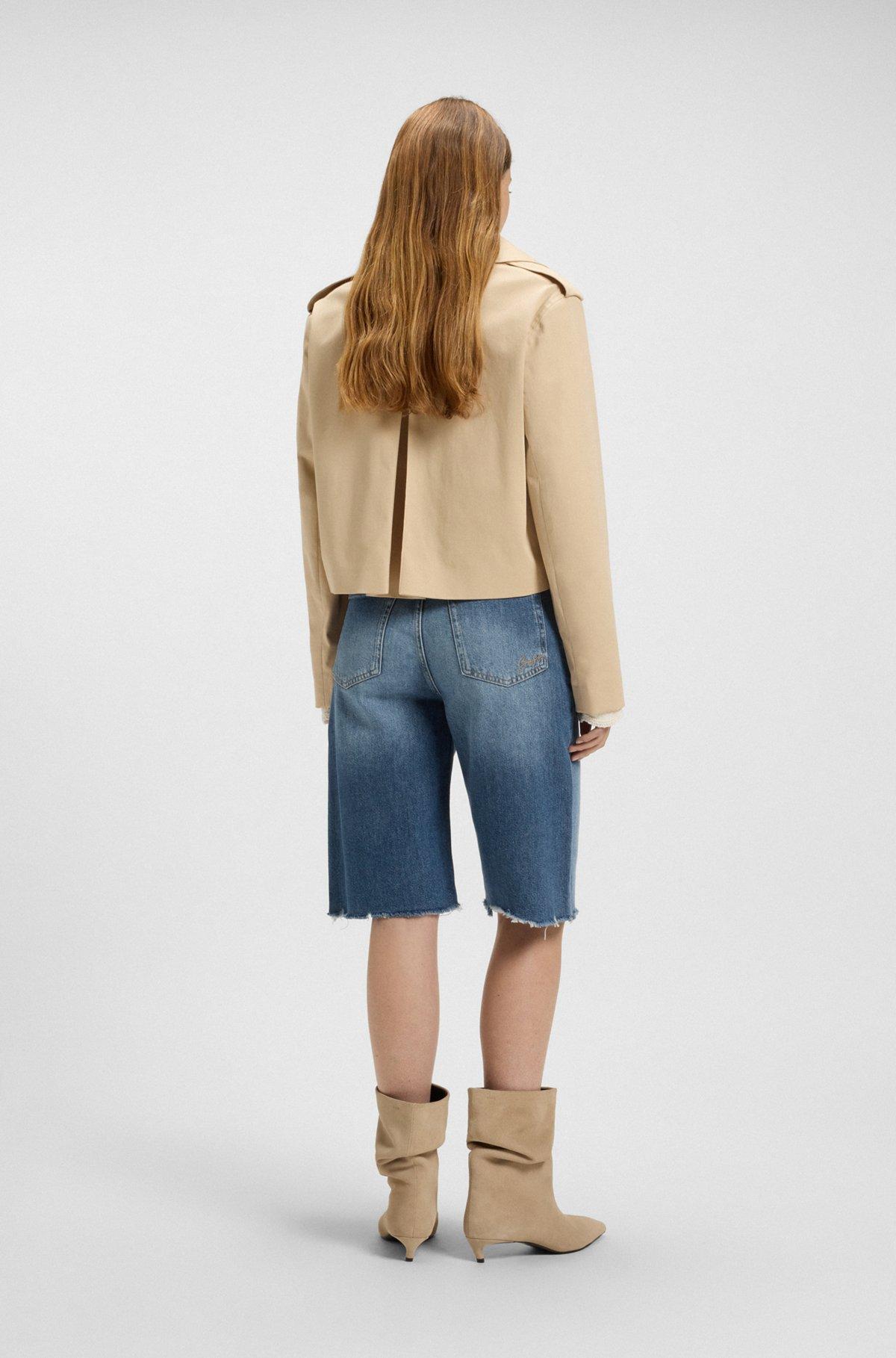 Knee-length denim shorts with raw hem Product Image