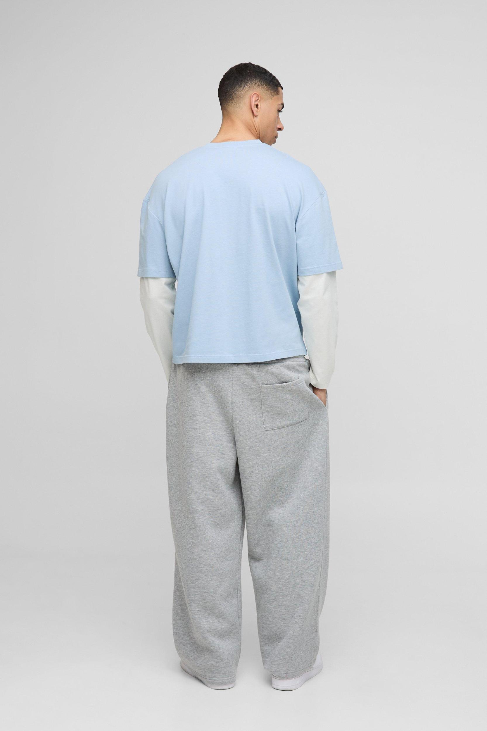 Oversized Boxy Woven Tab Faux Layer Sleeve Graphic V Neck T-Shirt | boohooMAN USA Product Image