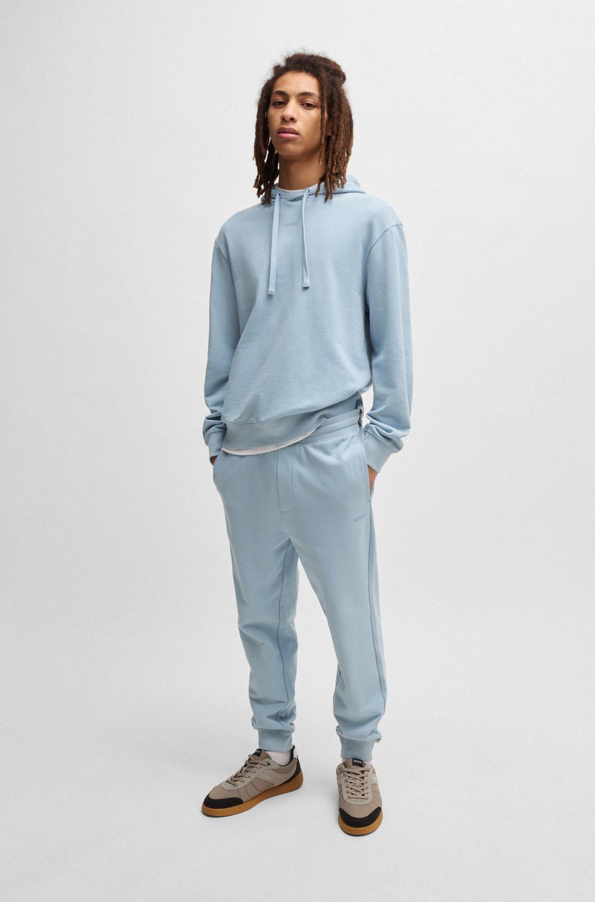 Cuffed tracksuit bottoms in cotton terry with logo print Product Image