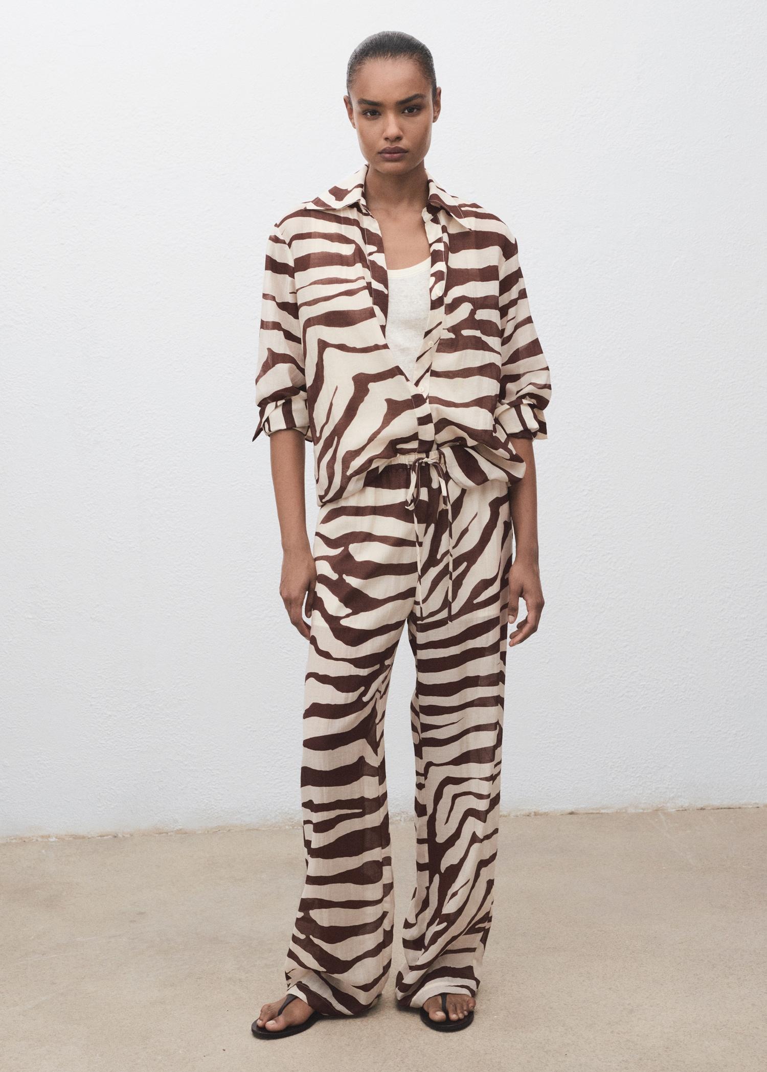Zebra-print fluid pants - Women | MANGO USA Product Image