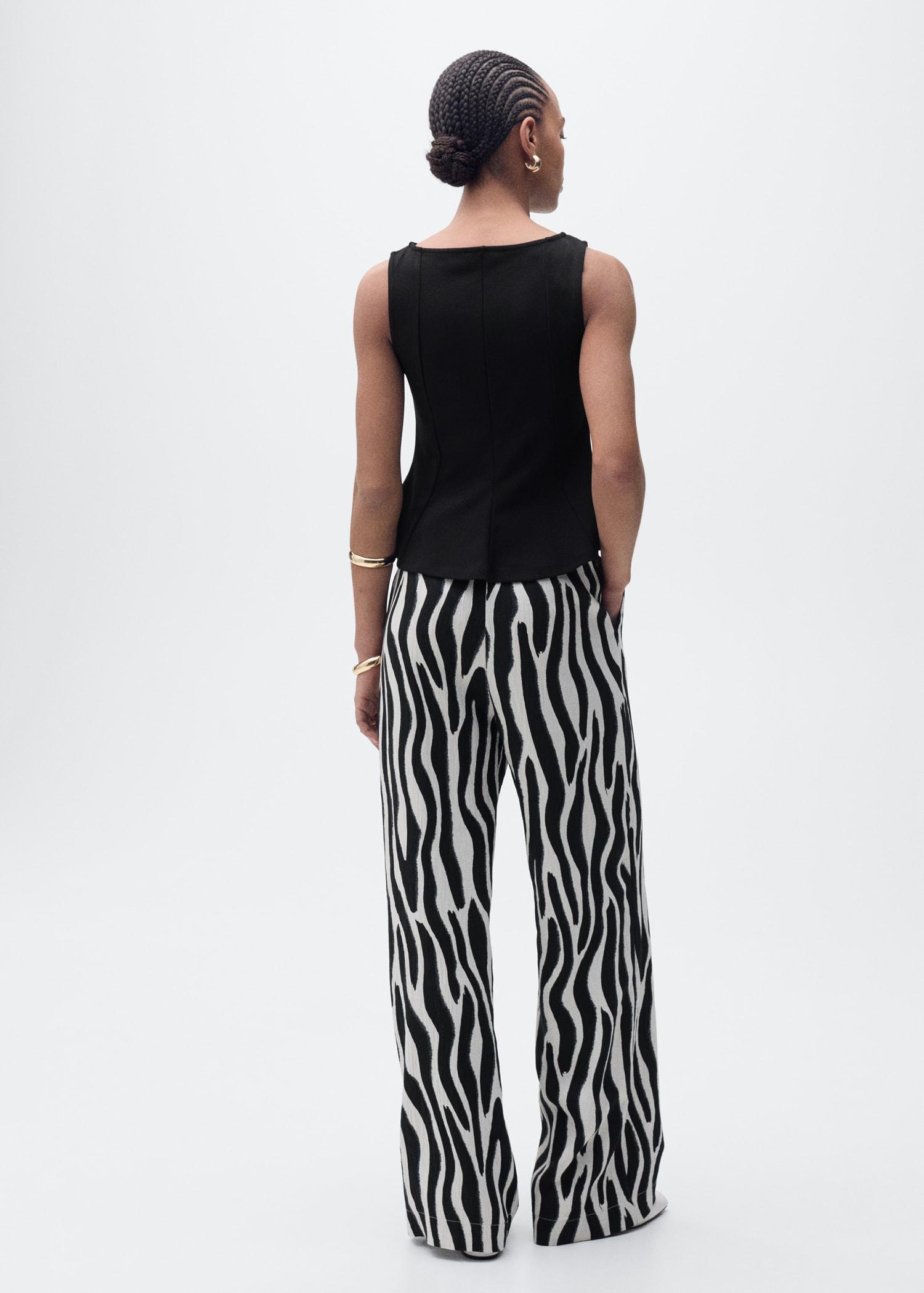 Peplum top with seam detail - Women | MANGO USA Product Image