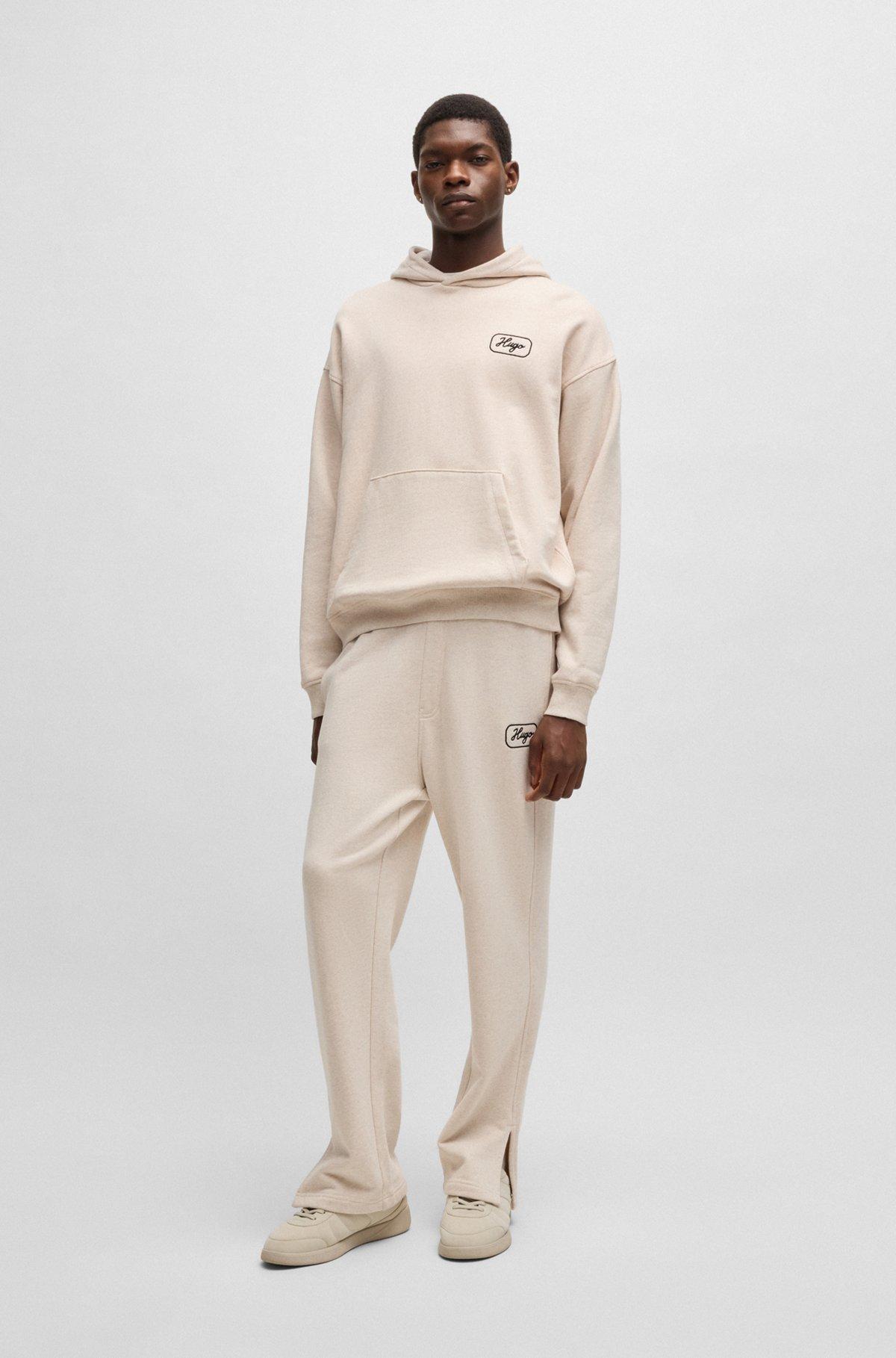 Cotton-terry tracksuit bottoms with embroidered graphics Product Image