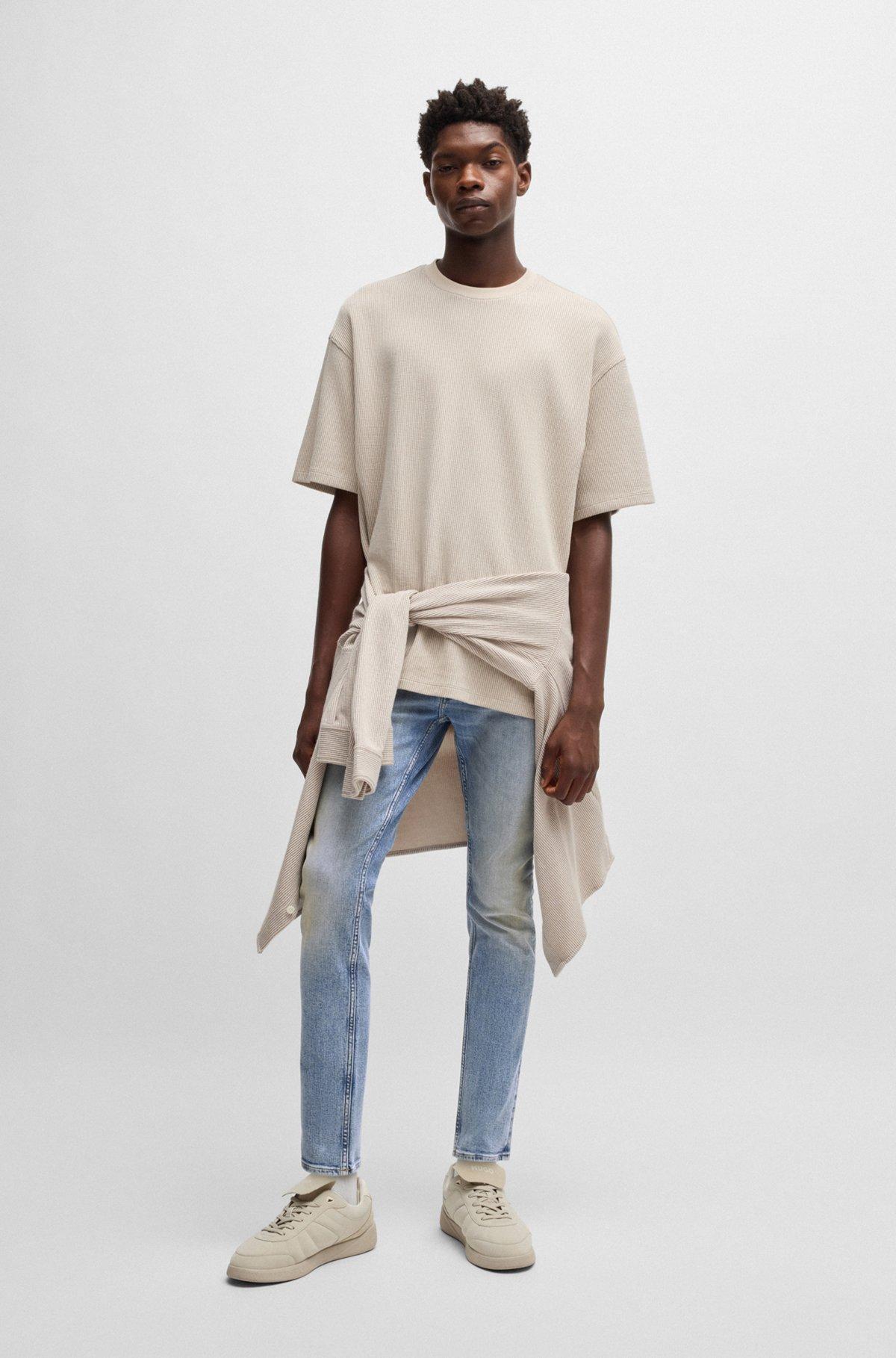 Extra-slim-fit jeans in stonewashed blue stretch denim Product Image