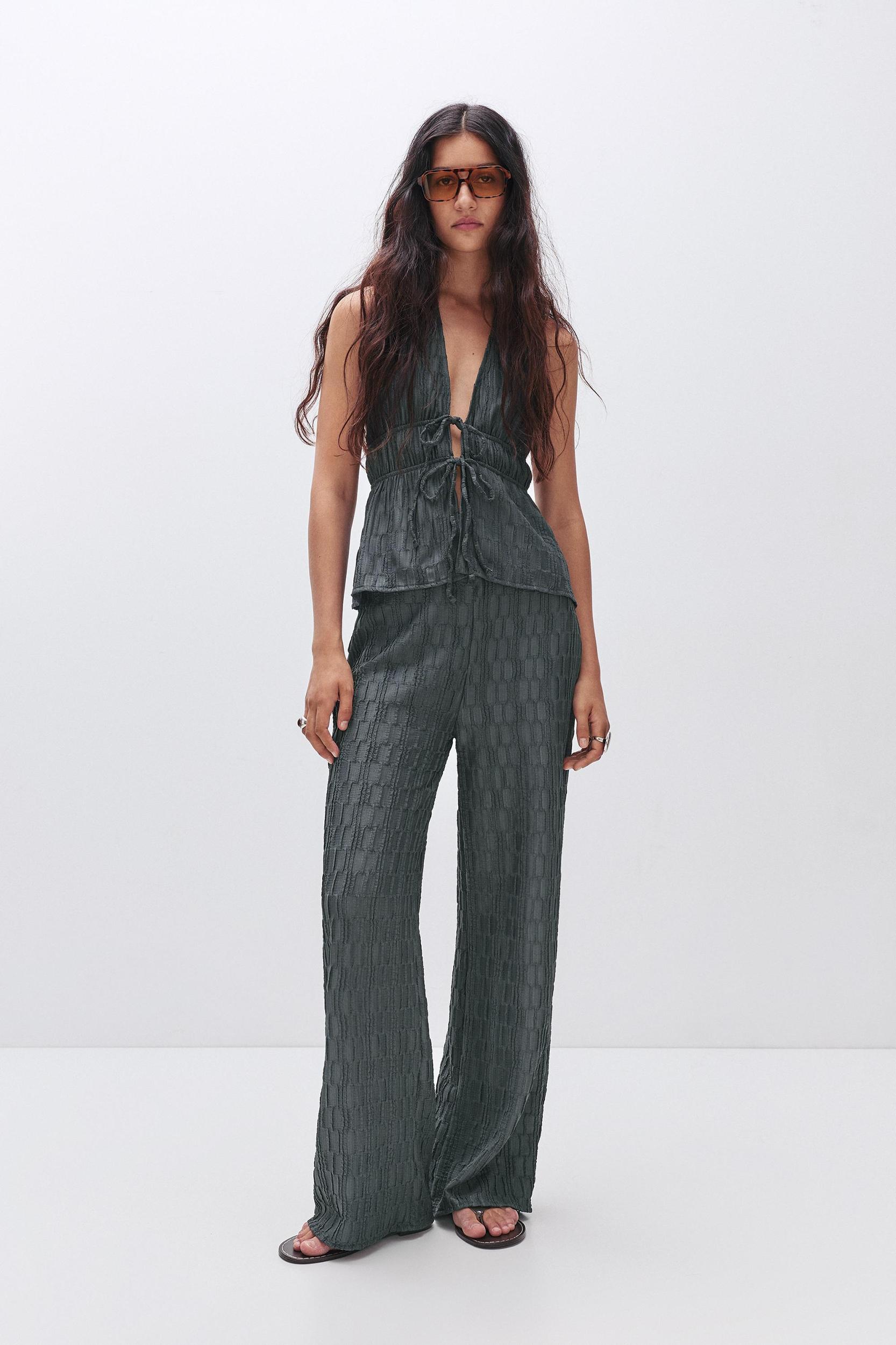Textured bell bottom trousers Product Image